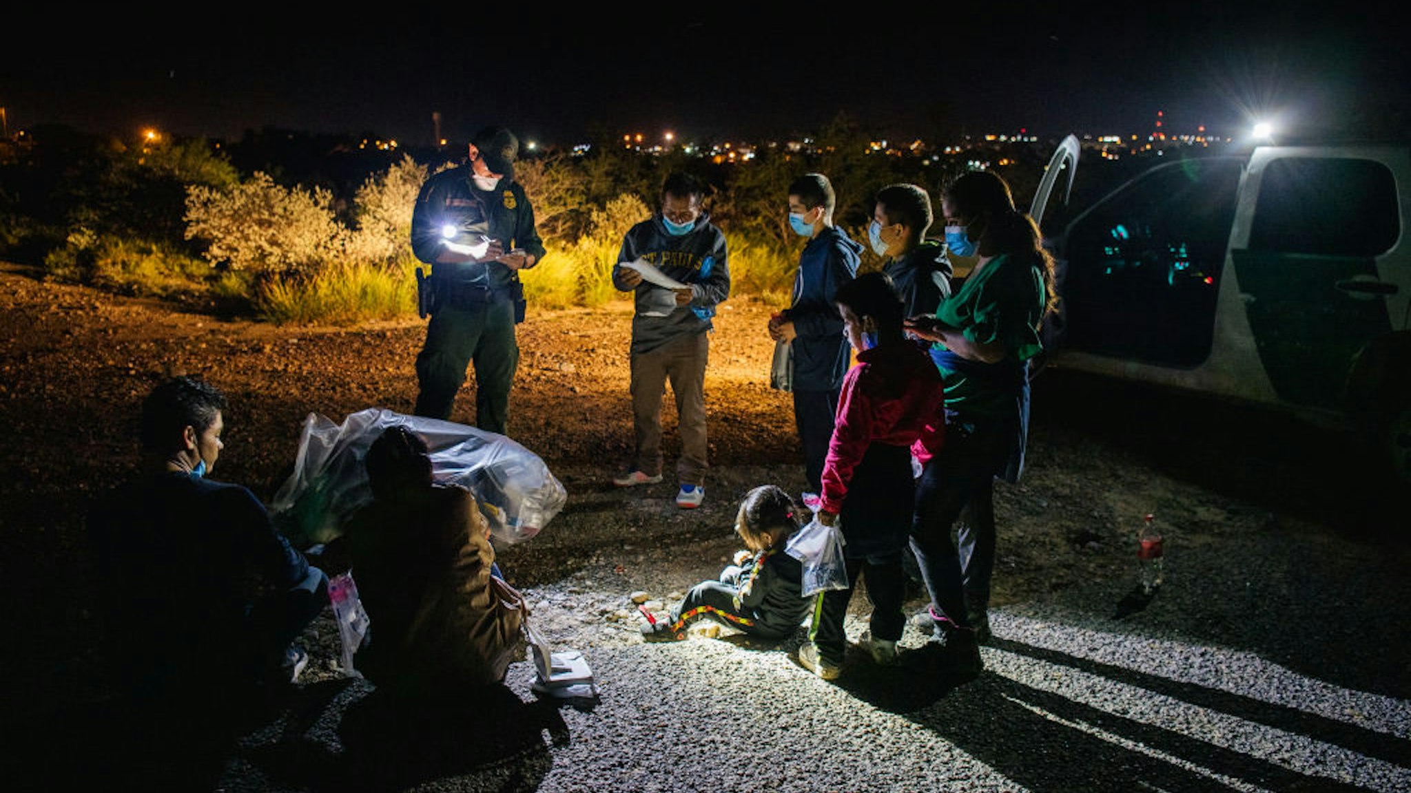 ROMA, TEXAS - JULY 01: Migrants are accounted for and processed by border patrol after crossing the Rio Grande into the United States on July 01, 2021 in Roma, Texas. Recently, Texas Gov. Greg Abbott has pledged to build a state-funded border wall as a surge of mostly Central American immigrants crossing into the United States continues to challenge U.S. immigration agencies. So far in 2021, the border patrol has apprehended more than 900,000 immigrants crossing into the U.S. from Mexico.