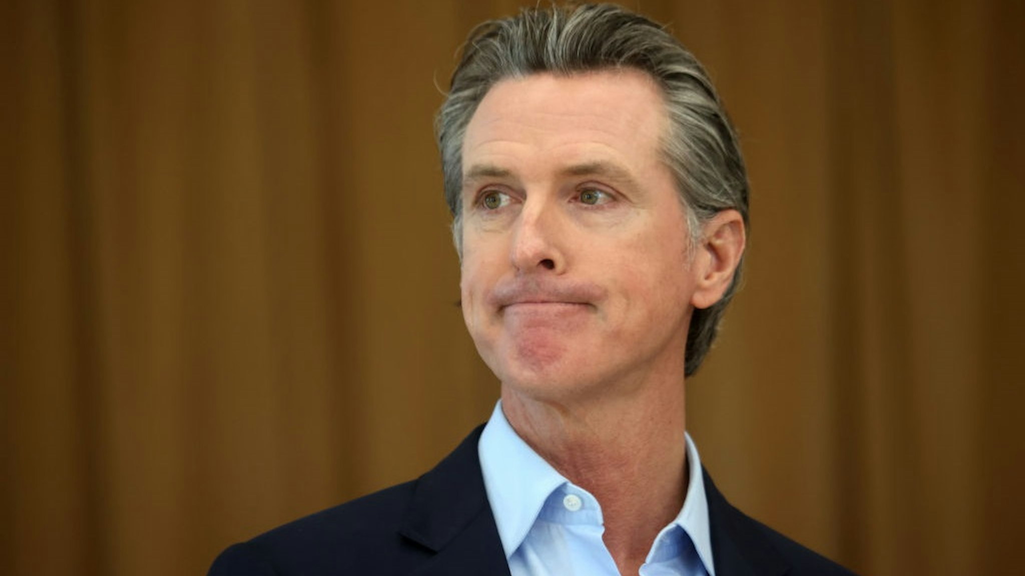 ALAMEDA, CALIFORNIA - MARCH 16: California Gov. Gavin Newsom looks on during a news conference after he toured the newly reopened Ruby Bridges Elementary School on March 16, 2021 in Alameda, California.