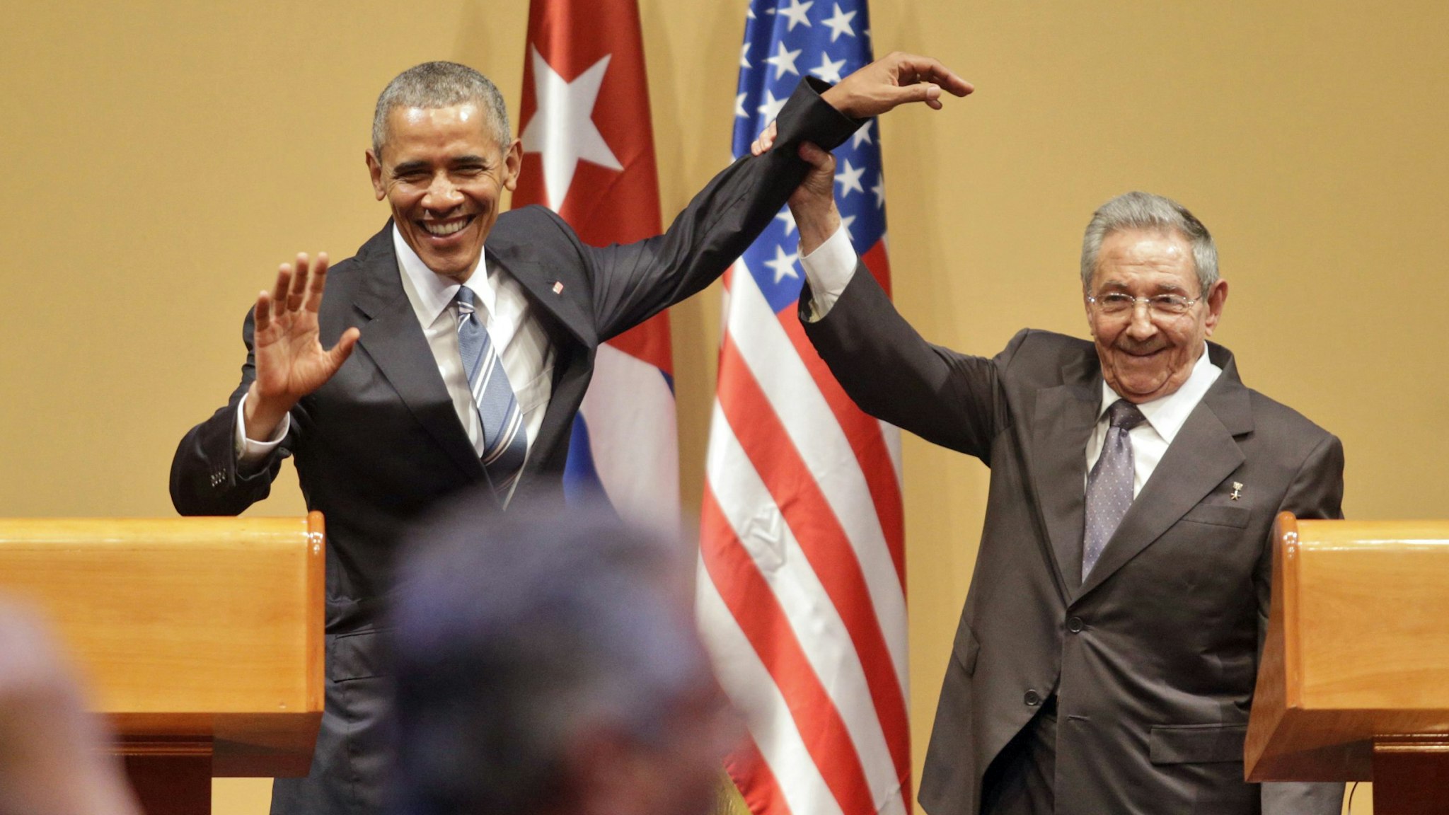 HAVANA, CUBA - MARCH 21: Cuba President Raul Castro (R) lifts the arm of U.S. President Barack Obama at the end of a joint press conference at the Cuban State Council, on March 21, 2016 in Havana, Cuba. Mr. Obama, who is on a 48 hour trip to Cuba, is the first sitting U.S. President to visit Cuba in almost 90 years.