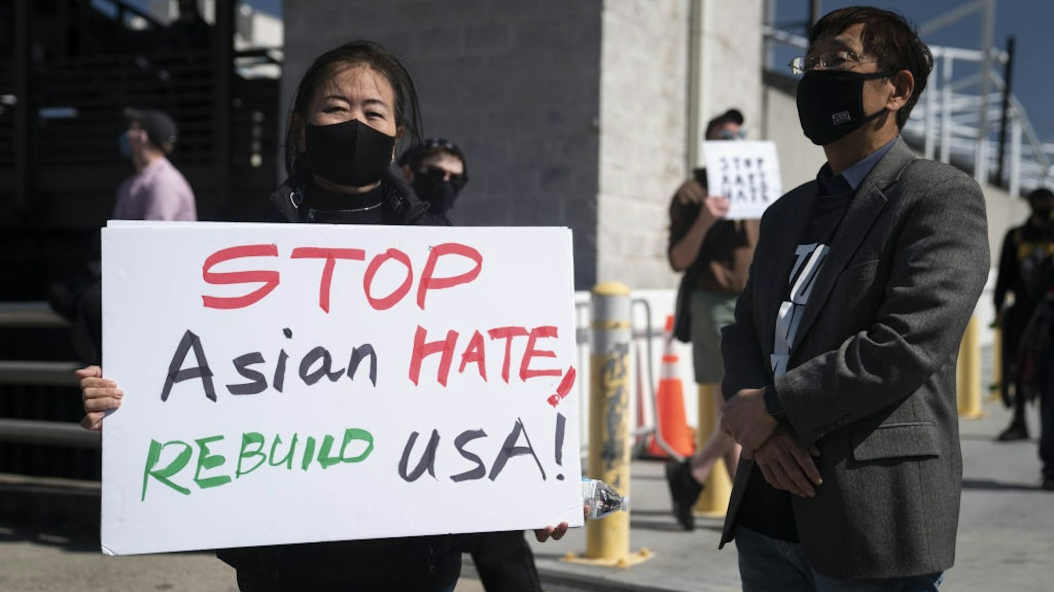 Demonstrators march to CNN Center following a Stop AAPI Hate Rally in Atlanta, Georgia, U.S., on Saturday, March 20, 2021.
