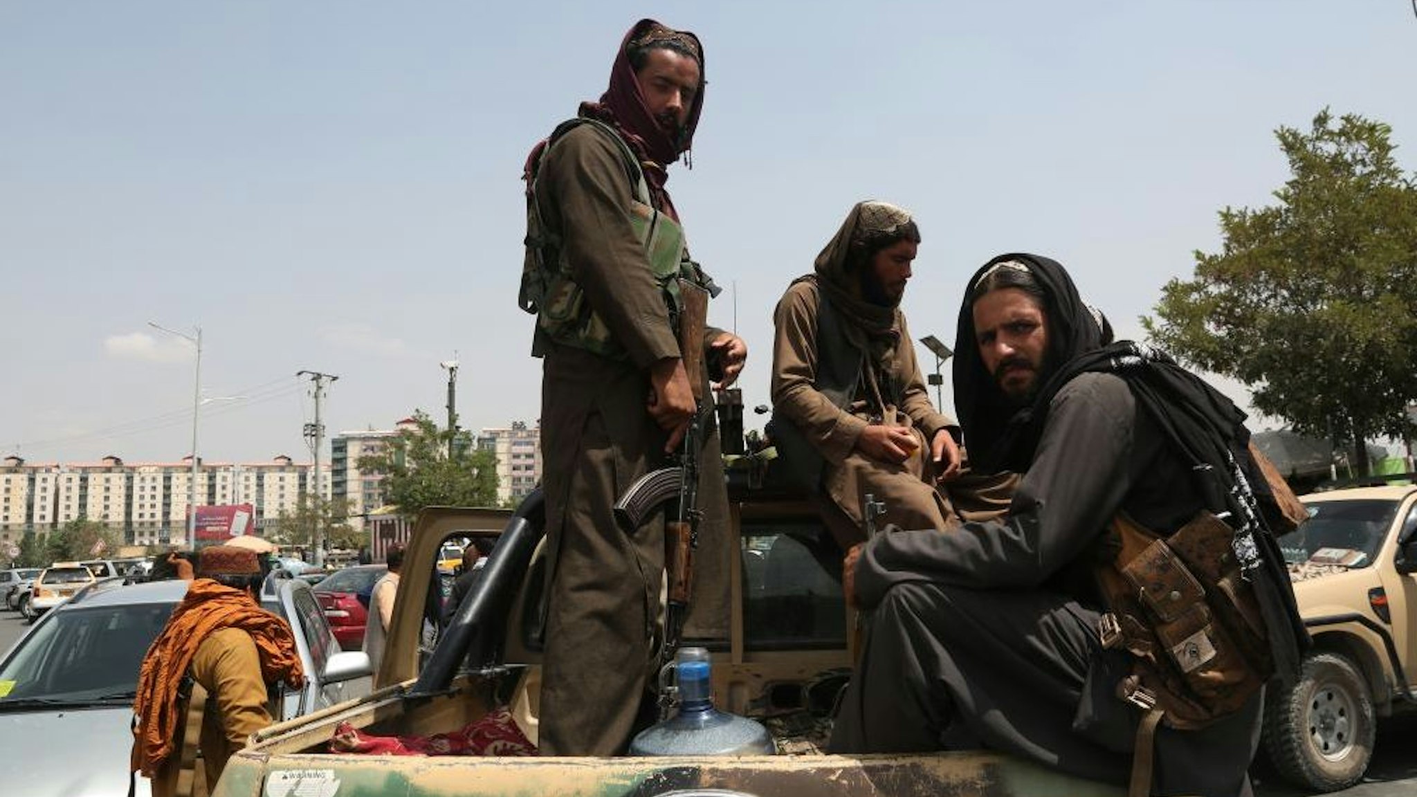 Taliban fighters are seen on a military vehicle in Kabul, capital of Afghanistan, Aug. 17, 2021. Normality has returned to Kabul, capital of Afghanistan as the Taliban on Tuesday urged the government employees to return to work, two days after the group took control of the capital. Declaring a general amnesty, the Taliban urged all to start routine life with confidence. It also urged women to join its government. Taliban spokesman Zabihullah Mujahid tweeted that the situation in Kabul was completely under control and law and order returned to the city.