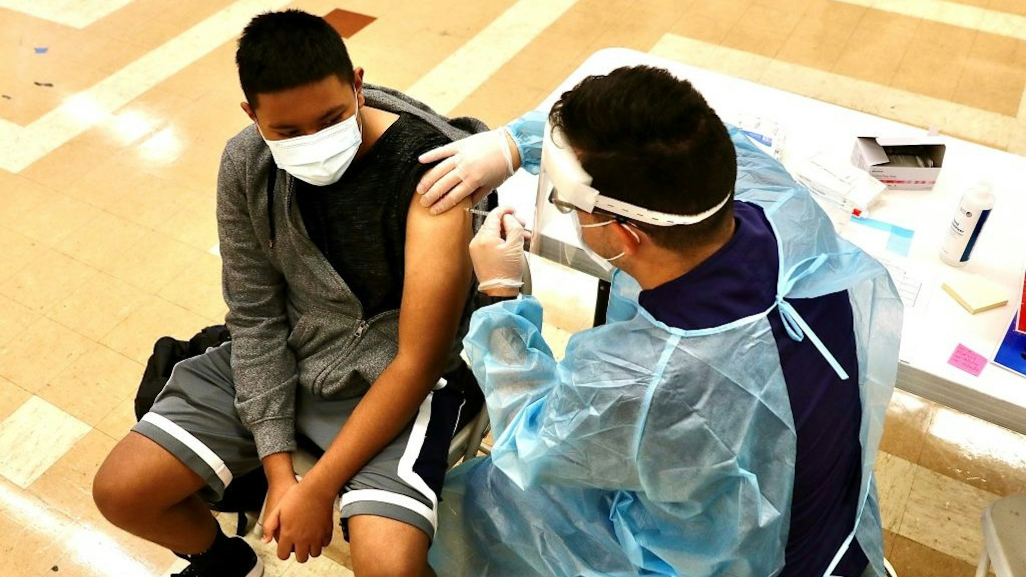 A student receives a dose of the COVID-19 vaccine at the Woodrow Wilson Senior High School in Los Angeles, California, the United States, on Aug. 30, 2021.