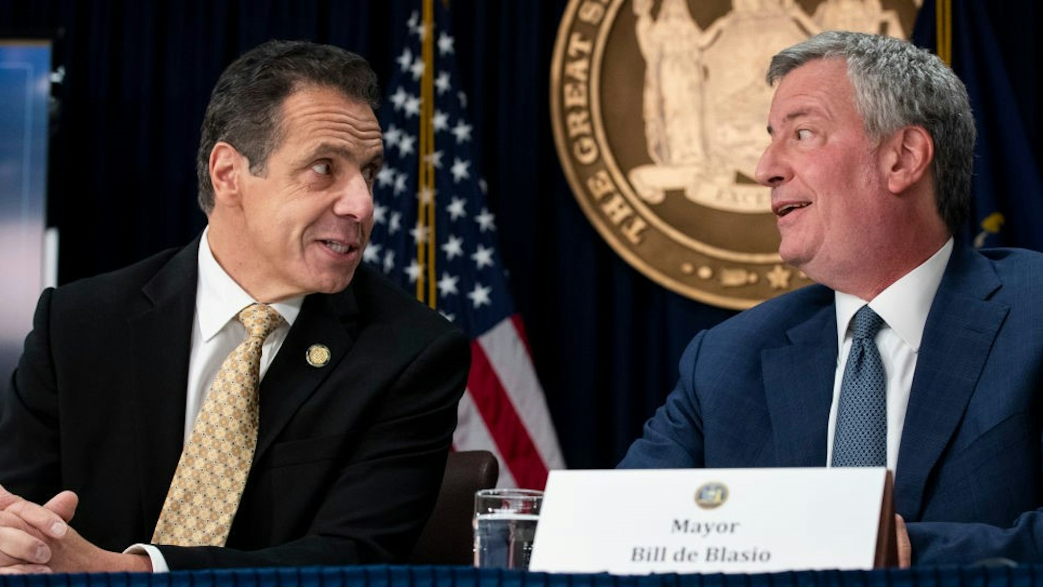 NEW YORK, NY - NOVEMBER 13: (L-R) New York Governor Andrew Cuomo and New York City Mayor Bill de Blasio talk with each other during a press conference to discuss Amazon's decision to bring a new corporate location to New York City, November 13, 2018 in New York City. Amazon announced earlier in the day that it has chosen Arlington, Virginia and Long Island City in Queens as the two locations, which will both serve as additional headquarters for the company. Amazon says each location will create 25,000 jobs. (Photo by