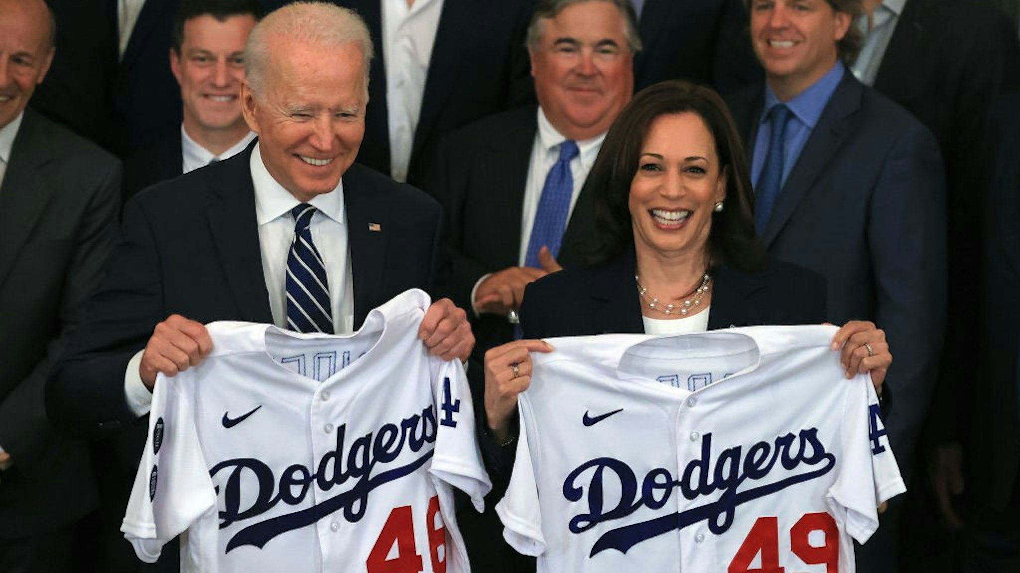 WASHINGTON, DC - JULY 02: U.S. President Joe Biden and Vice President Kamala Harris pose with the jerseys given to them by the 2020 World Series champion Los Angeles Dodgers during a congratulatory event in the East Room of the White House on July 02, 2021 in Washington, DC. The Dodgers defeated the Tampa Bay Rays to win the championship series at the end of an abbreviated season due to the coronavirus. (Photo by