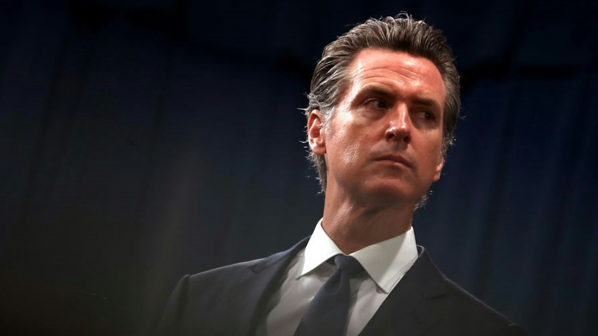 SACRAMENTO, CALIFORNIA - AUGUST 16: California Gov. Gavin Newsom looks on during a news conference with California attorney General Xavier Becerra at the California State Capitol on August 16, 2019 in Sacramento, California. California attorney genera Xavier Becerra and California Gov. Gavin Newsom announced that the State of California is suing the Trump administration challenging the legality of a new "public charge" rule that would make it difficult for immigrants to obtain green cards who receive public assistance like food stamps and Medicaid. (Photo by