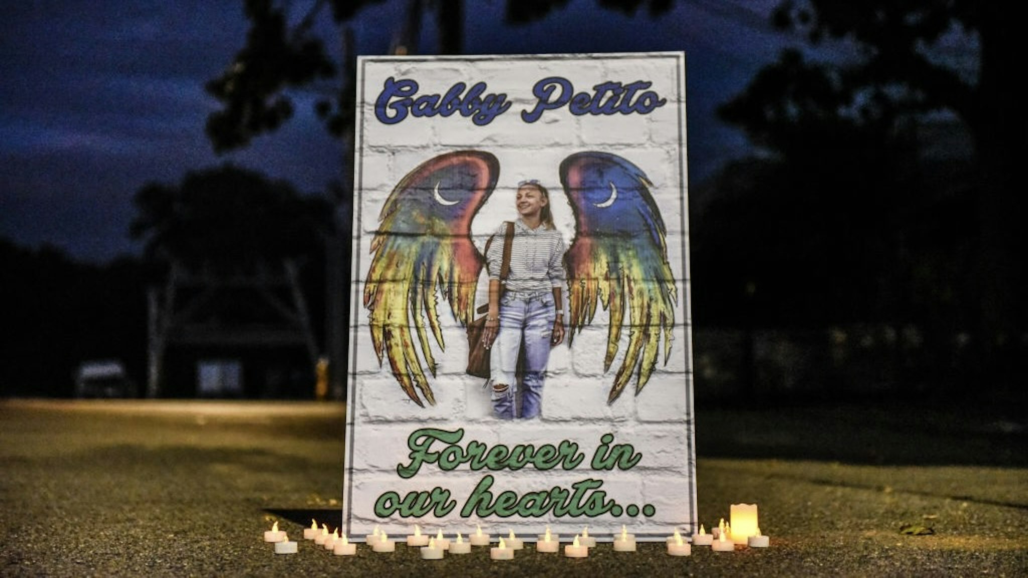 Gabby Petito's Hometown Of Blue Point, Long Island Mourns Her Death BLUE POINT, NY - SEPTEMBER 24: A sign honors the death of Gabby Petito on September 24, 2021 in Blue Point, New York. Gabby Petito's hometown of Blue Point put out candles along main streets and in driveways to honor the teenager who has riveted the nation since the details of her death became known. (Photo by Stephanie Keith/Getty Images) Stephanie Keith / Stringer via Getty Images