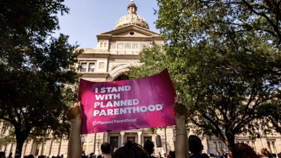 Texans Rally At State Capitol Against New Abortion Bill AUSTIN, TX - SEPTEMBER 11: An abortion rights activist holds a sign in support of Planned Parenthood at a rally at the Texas State Capitol on September 11, 2021 in Austin, Texas. Texas Lawmakers recently passed several pieces of conservative legislation, including SB8, which prohibits abortions in Texas after a fetal heartbeat is detected on an ultrasound, usually between the fifth and sixth weeks of pregnancy. (Photo by Jordan Vonderhaar/Getty Images) Jordan Vonderhaar / Stringer