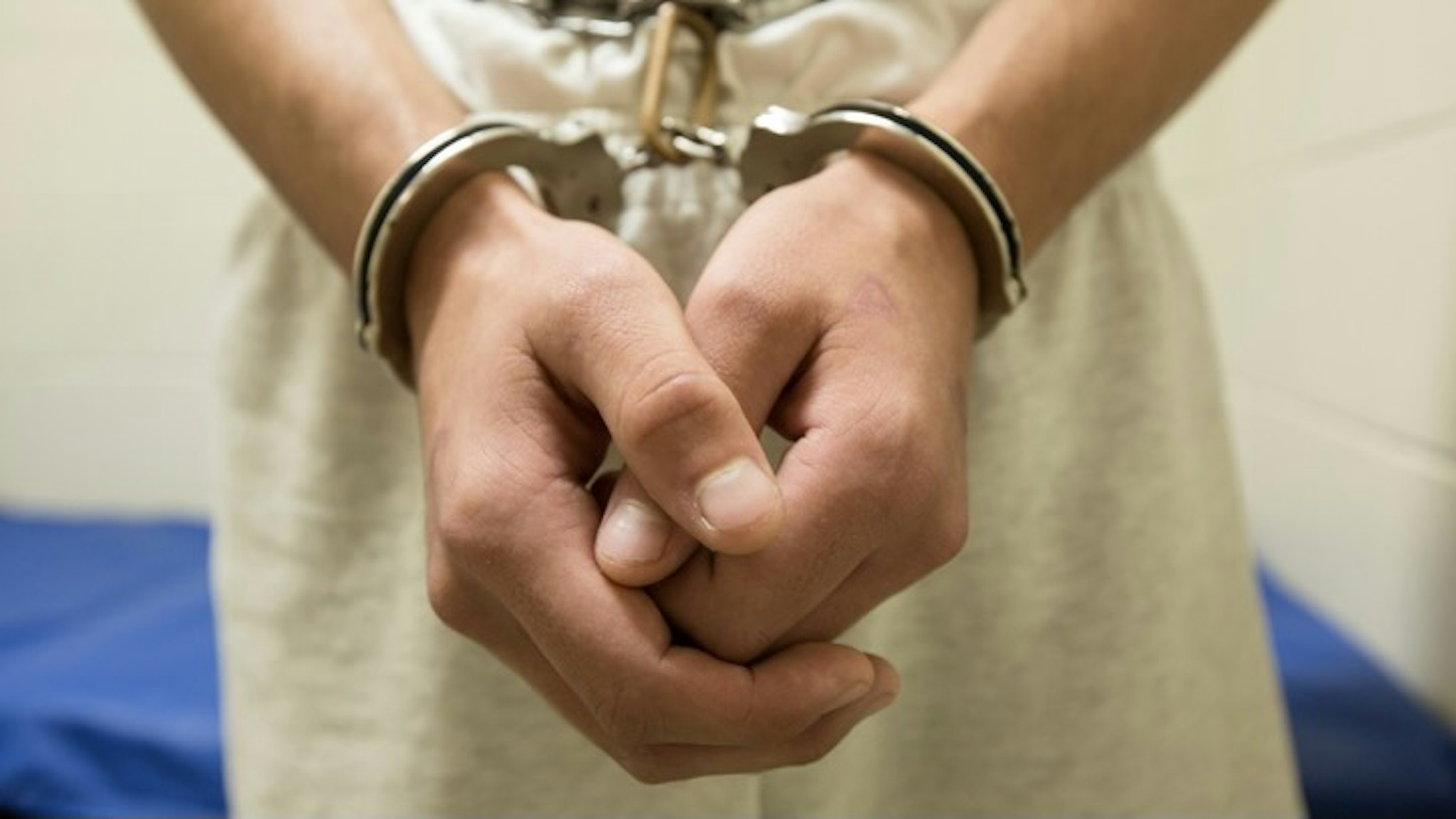 Teenage boy in shackles - stock photo Richard Ross via Getty Images