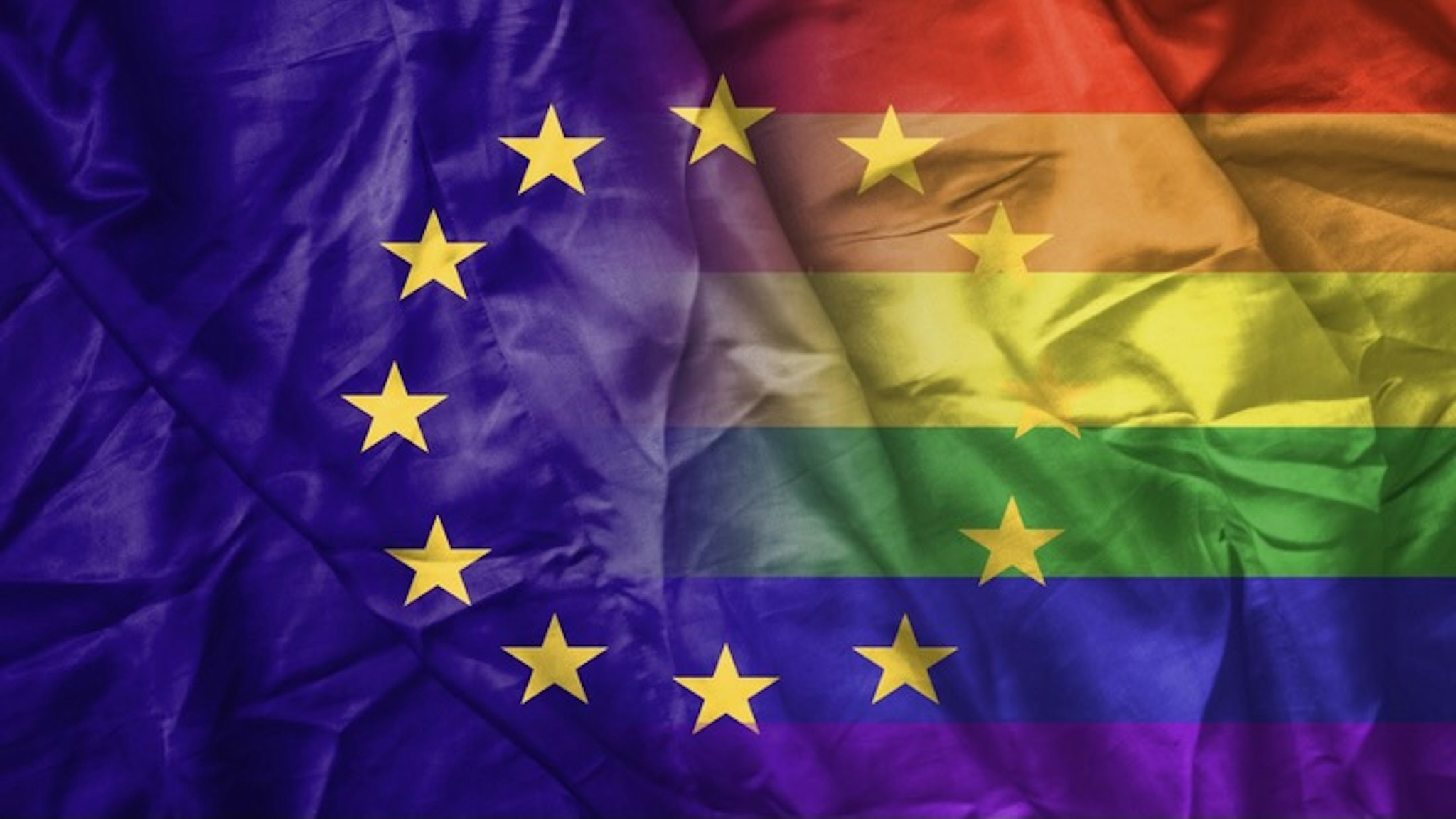 EU and rainbow gay pride flag - stock photo EU and rainbow gay pride flag Martinns via Getty Images