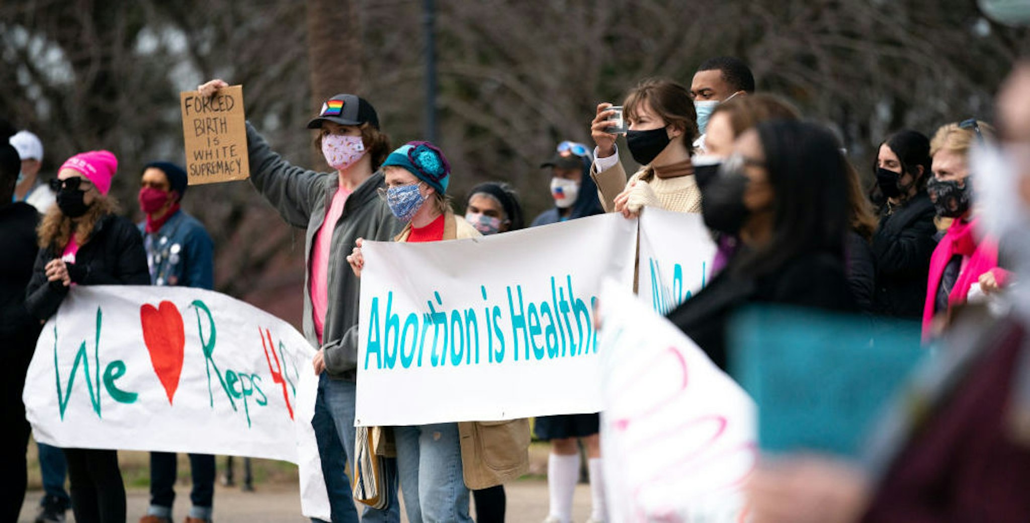 COLUMBIA, SOUTH CAROLINA, UNITED STATES - 2021/02/17: Demonstrators holding placards and banners expressing their opinion, during a press conference and protest by Democrats who walked out during a debate on an anti-abortion bill in the House of Representatives. Republicans passed the bill and after being signed by the Governor, it will most likely cause a constitutional showdown in the courts.
