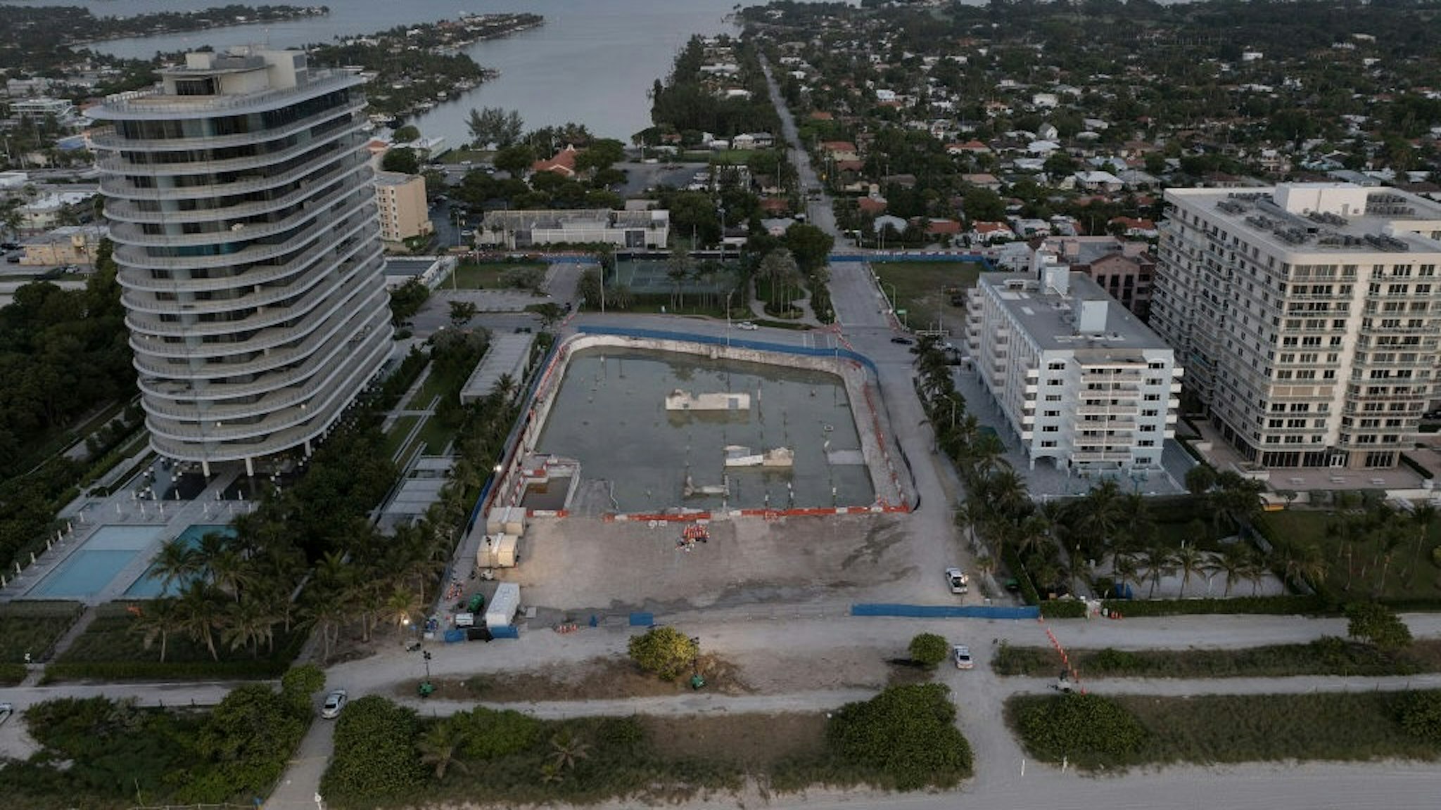 Investigation Continues At Site Of Surfside Building Collapse SURFSIDE, FLORIDA - JULY 31: In this aerial view, the cleared lot that was where the collapsed 12-story Champlain Towers South condo building once stood on July 31, 2021 in Surfside, Florida. A total of 98 people died when the building partially collapsed on June 24, 2021. (Photo by Joe Raedle/Getty Images) Joe Raedle / Staff via Getty Images