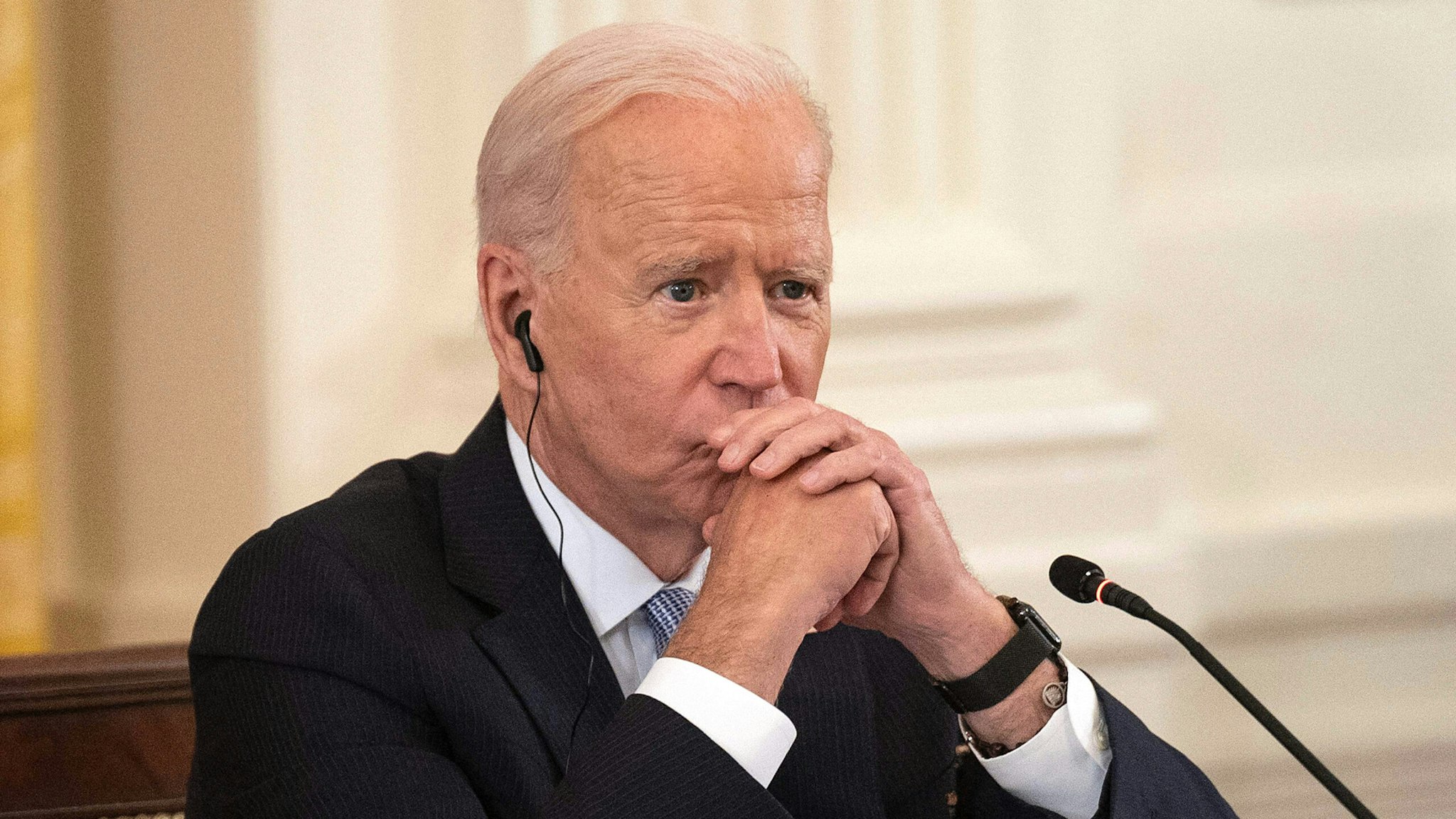 US President Joe Biden listens as India Prime Minister Narendra Modi speaks with Japan Prime Minister Suga Yoshihide and Australian Primer Minister Scott Morrison during the first-ever in-person Quad Leaders Summit in the East Room of the White House in Washington, DC, on September 24, 2021.
