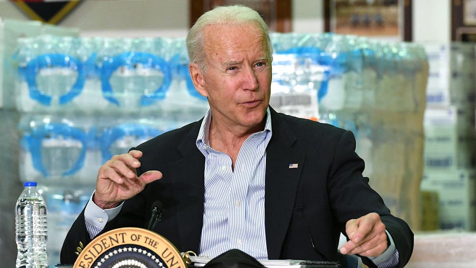 US-POLITICS-HURRICANE-BIDEN US President Joe Biden takes part in a briefing with local leaders in the aftermath of Hurricane Ida at the Somerset County Emergency Management Training Center in Hillsborough Township, New Jersey on September 7, 2021. - President Joe Biden headed Tuesday to storm-ravaged New York and New Jersey, just days after inspecting the damage caused by Hurricane Ida in Louisiana. Biden -- who is pushing a giant infrastructure spending bill, including major funding for the green economy -- argues that extreme weather across the United States this summer is a harbinger of worse climate change to come.