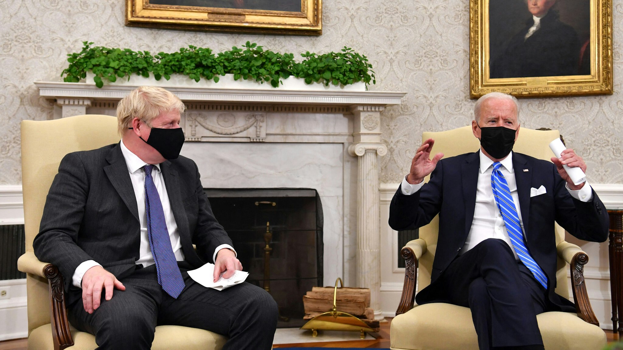 US President Joe Biden (R) holds a bilateral meeting with Britain's Prime Minister Boris Johnson at the Oval Office of the White House in Washington, DC on September 21, 2021.