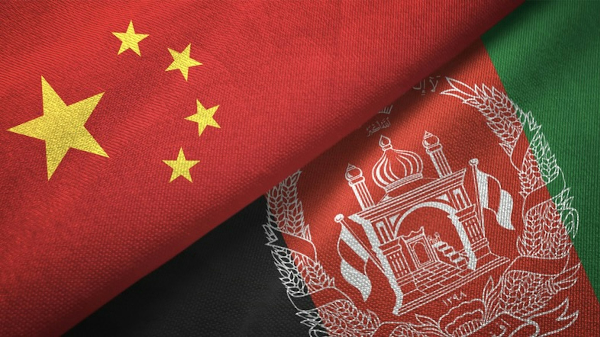 Afghanistan and China two flags together realations textile cloth fabric texture - stock photo Afghanistan and China flag together realtions textile cloth fabric texture Oleksii Liskonih via Getty Images
