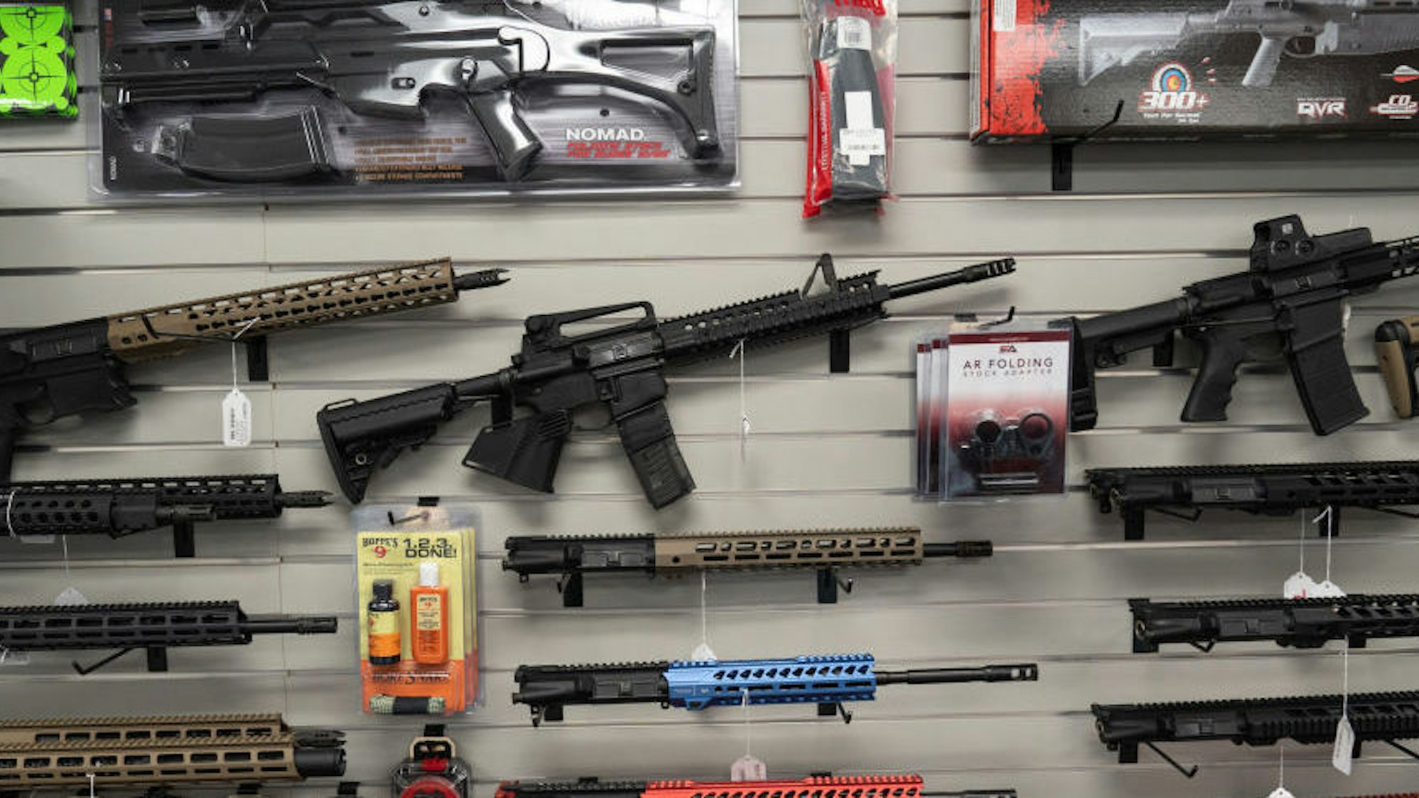 California-compliant AR-15 upper receivers, rifles, and gun accessories for sale at Hiram's Guns / Firearms Unknown store in El Cajon, California, U.S., on Monday, April 26, 2021. President Joe Biden's planned executive actions would crack down on "ghost guns," which can be assembled from kits and are not traceable by law enforcement because they lack serial numbers, as well as braces for pistols that make firearms more stable and accurate.