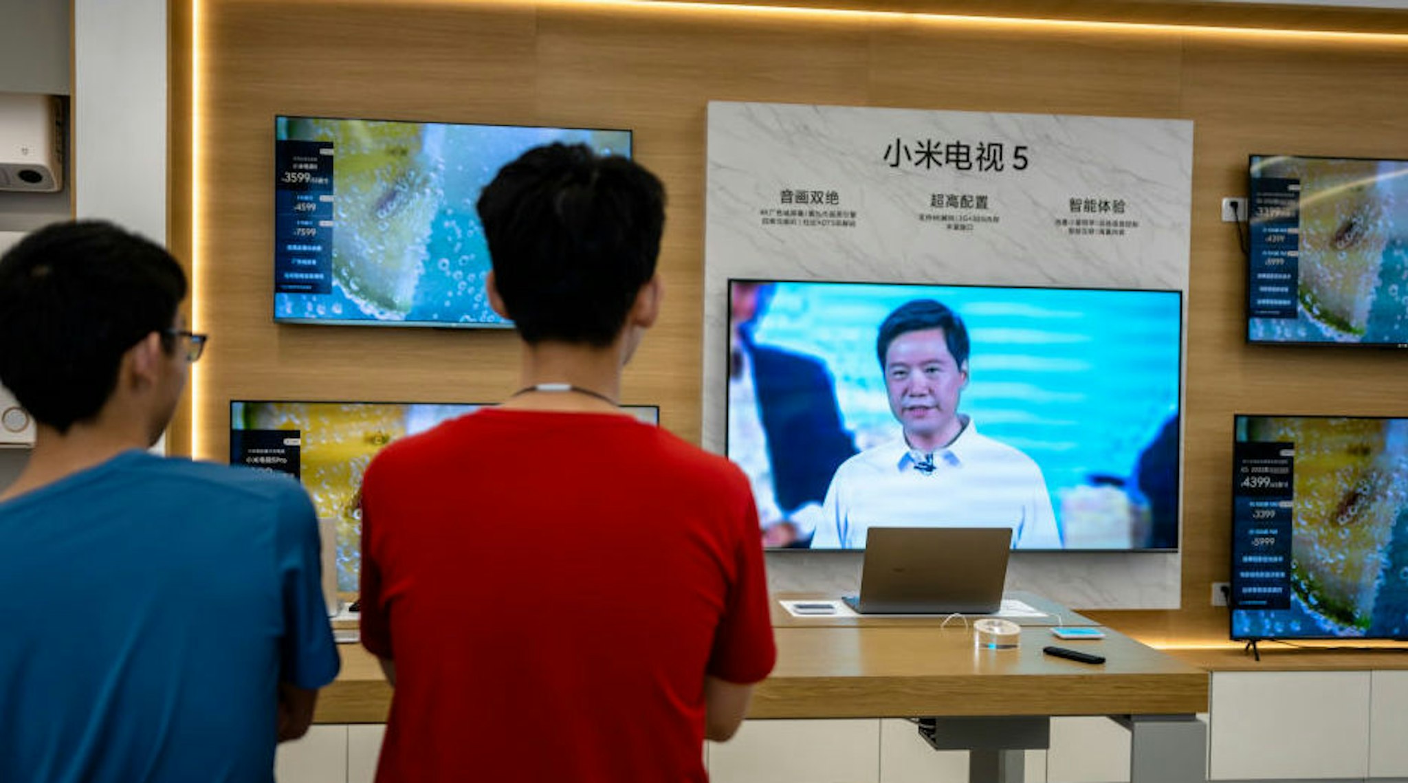 SHAOXING, CHINA - AUGUST 10: A TV inside a Xiaomi store broadcasts live Xiaomi's online product launch event on August 10, 2021 in Shaoxing, Zhejiang Province of China. Xiaomi founder and CEO Lei Jun launched Mi MIX 4 smartphones on Tuesday.