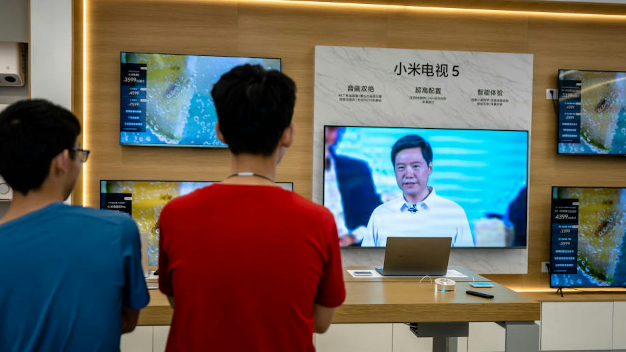 SHAOXING, CHINA - AUGUST 10: A TV inside a Xiaomi store broadcasts live Xiaomi's online product launch event on August 10, 2021 in Shaoxing, Zhejiang Province of China. Xiaomi founder and CEO Lei Jun launched Mi MIX 4 smartphones on Tuesday.