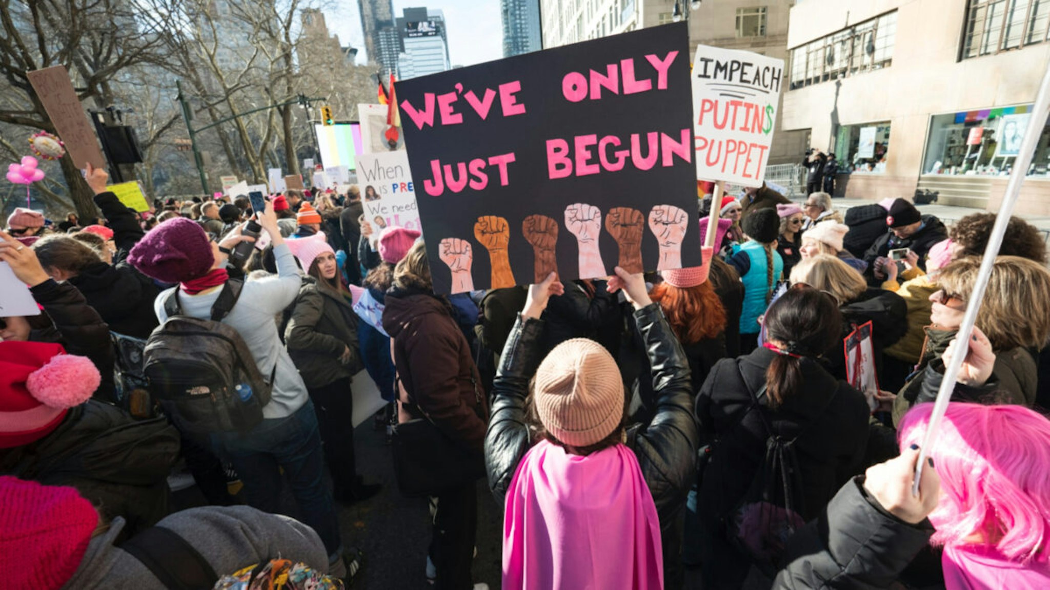 A demonstrator holds up a banner saying "We've Only Just Begun" during the second annual Women's March in the borough of Manhattan in New York City, U.S. on Saturday, January 20, 2018.