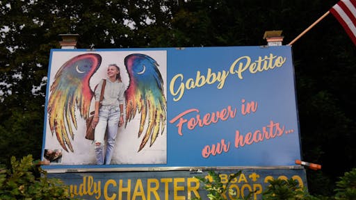 Gabby Petito BLUE POINT, NY - SEPTEMBER 24: A sign honors the death of Gabby Petito on September 24, 2021 in Blue Point, New York. Gabby Petito's hometown of Blue Point put out candles along main streets and in driveways to honor the teenager who has riveted the nation since the details of her death became known. (Photo by Stephanie Keith/Getty Images)