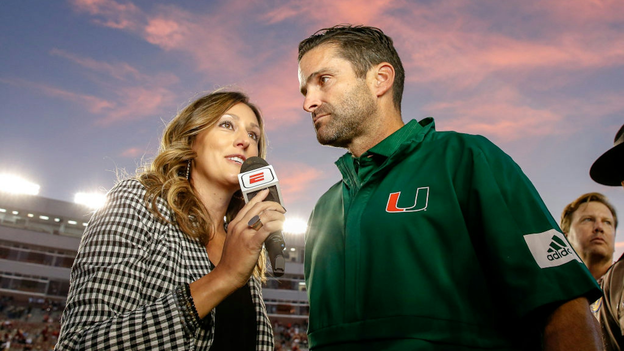 TALLAHASSEE, FL - NOVEMBER 2: ESPN Sideline Reporter Allison Williams interviews Head Coach Manny Diaz of the Miami Hurricanes after the game against the Florida State Seminoles at Doak Campbell Stadium on Bobby Bowden Field on November 2, 2019 in Tallahassee, Florida. Miami defeated Florida State 27 to 10. (Photo by Don Juan Moore/Getty Images)