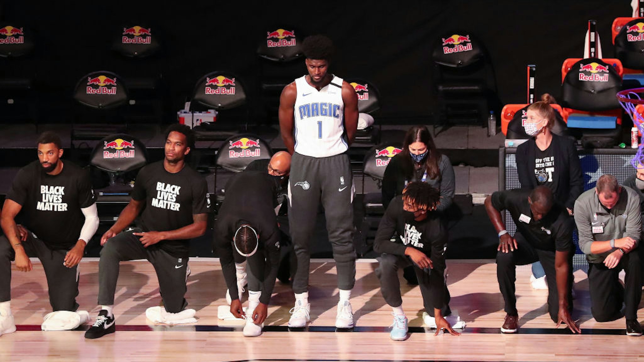 Orlando Magic forward Jonathan Isaac (1) is the lone player to stand and not wear a "Black Lives Matter" t-shirt prior to a game against the Brooklyn Nets at Disney's Wide World of Sports' HP Field House in Lake Buena Vista, Florida, on Friday, July 31, 2020. (Charles King/Orlando Sentinel/Tribune News Service via Getty Images)