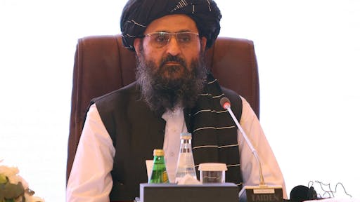 QATAR-AFGHANISTAN-CONFLICT-TALIBAN The leader of the Taliban negotiating team Mullah Abdul Ghani Baradar looks on during the final declaration of the peace talks between the Afghan government and the Taliban is presented in Qatar's capital Doha on July 18, 2021. - Representatives of the Afghan government and Taliban insurgents held talks in Doha as violence raged in their country with foreign forces almost entirely withdrawn. The two sides have been meeting on and off for months in the Qatari capital, but the talks have lost momentum as the insurgents made battlefield gains. (Photo by KARIM JAAFAR / AFP) (Photo by KARIM JAAFAR/AFP via Getty Images)
