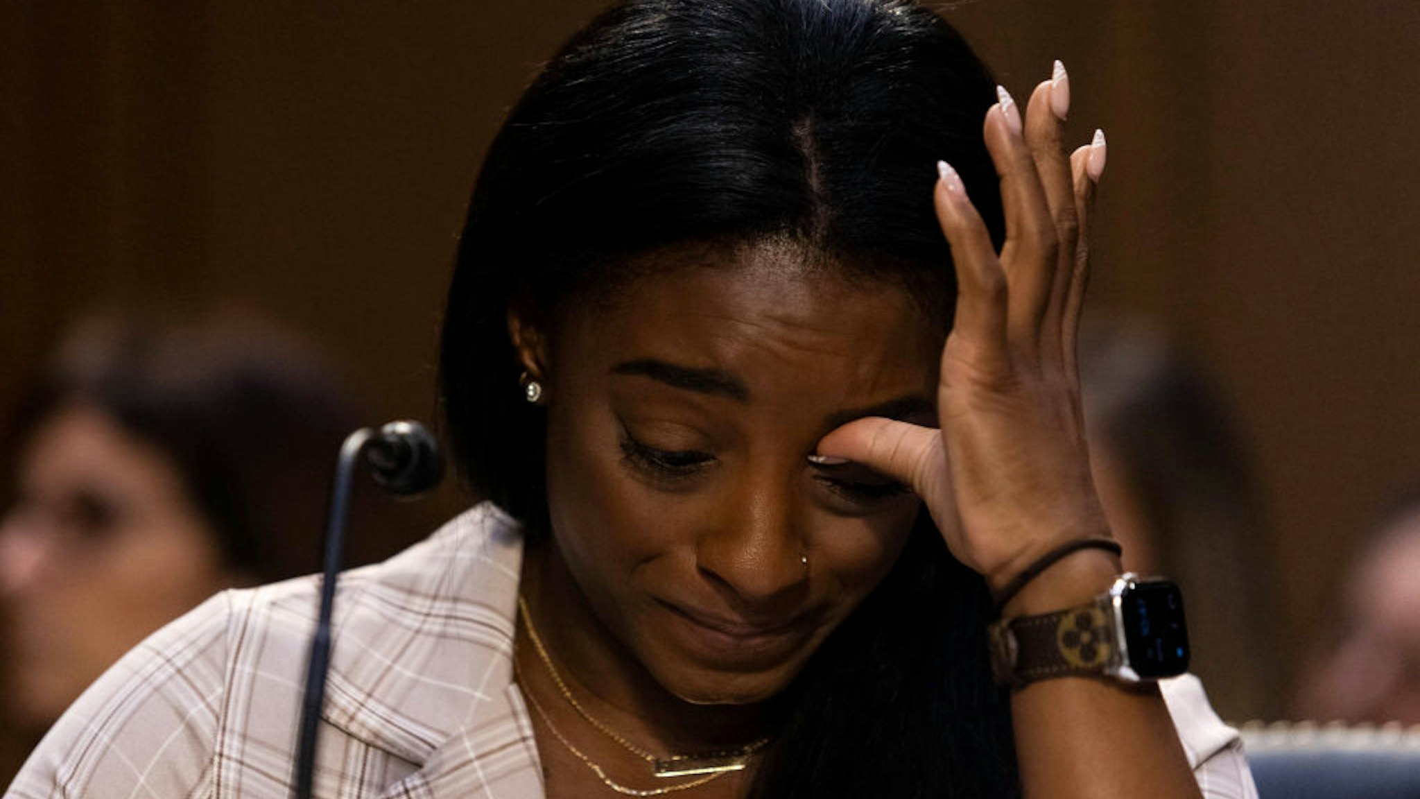 U.S. Olympic gymnast Simone Biles testifies during a Senate Judiciary hearing about the Inspector General's report on the FBI's handling of the Larry Nassar investigation on Capitol Hill, on September 15, 2021 in Washington, DC. Nassar was charged in 2016 with federal child pornography offenses and sexual abuse charges in Michigan. He is now serving decades in prison after hundreds of girls and women said he sexually abused them under the guise of medical treatment when he worked for Michigan State and Indiana-based USA Gymnastics, which trains Olympians. (Photo by Graeme Jennings-Pool/Getty Images)