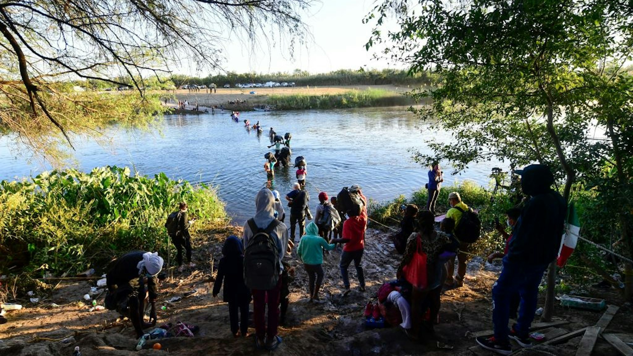 Haitian migrants cross the Rio Grande river as seen from Ciudad Acuna, Coahuila state, Mexico, on September 23, 2021. - Tension reigns this Thursday in a Haitian migrant camp in Ciudad Acuña (on the border with the United States), after the arrival of dozens of Mexican police officers. (Photo by PEDRO PARDO / AFP) (Photo by PEDRO PARDO/AFP via Getty Images)