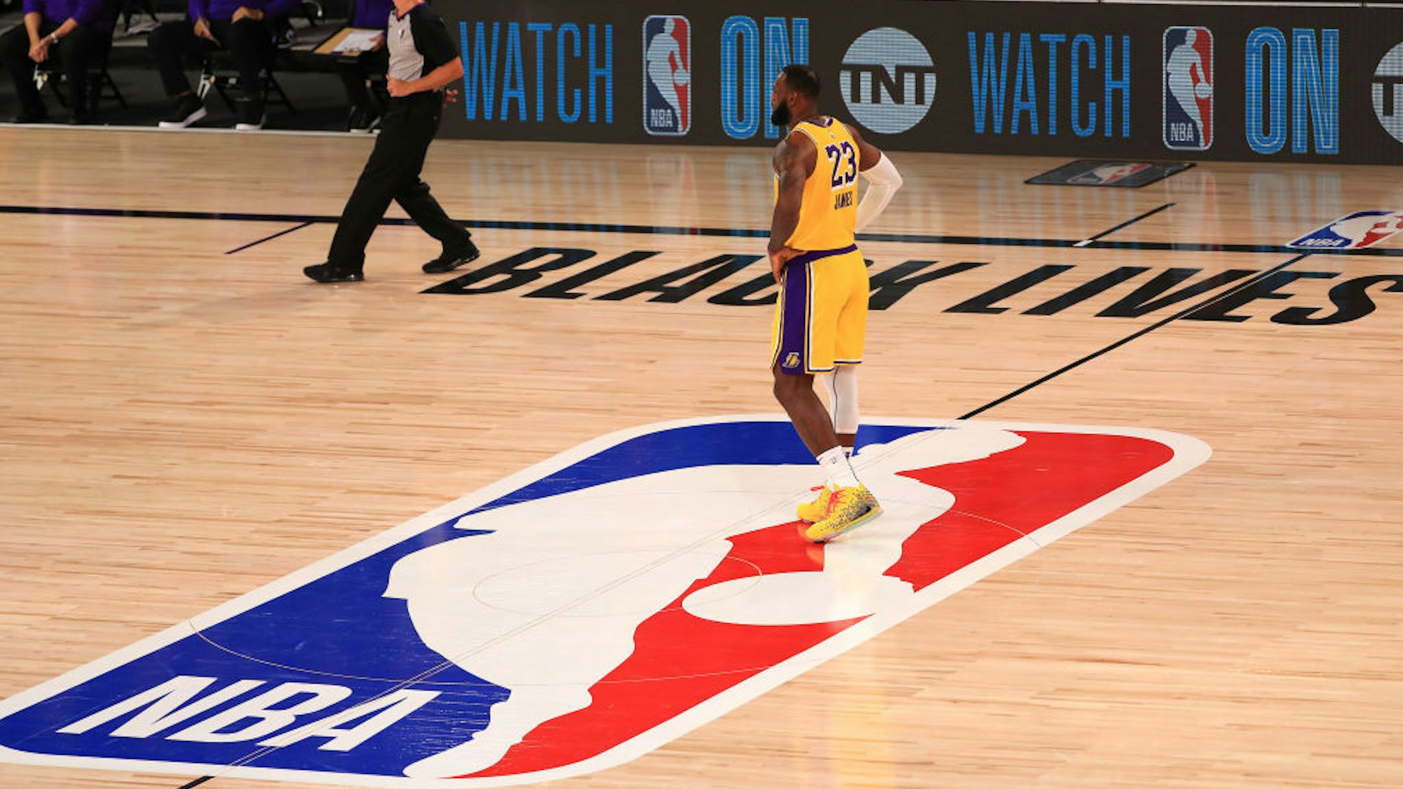 LAKE BUENA VISTA, FLORIDA - JULY 30: LeBron James #23 of the Los Angeles Lakers stands on the NBA logo against the LA Clippers during the second quarter of the game at The Arena at ESPN Wide World Of Sports Complex on July 30, 2020 in Lake Buena Vista, Florida. NOTE TO USER: User expressly acknowledges and agrees that, by downloading and or using this photograph, User is consenting to the terms and conditions of the Getty Images License Agreement. (Photo by Mike Ehrmann/Getty Images)