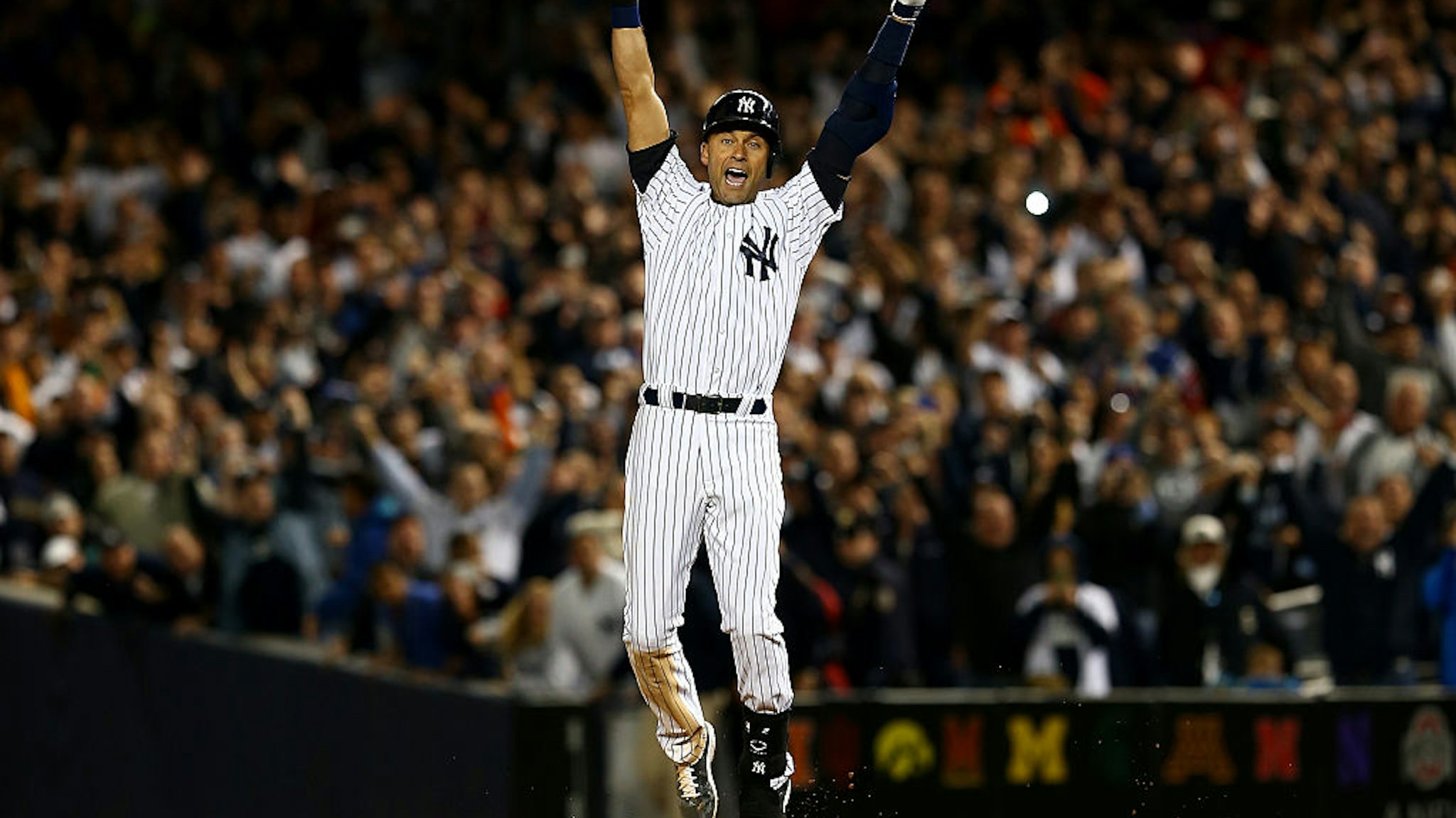 NEW YORK, NY - SEPTEMBER 25: Derek Jeter #2 of the New York Yankees celebrates after a game winning RBI hit in the ninth inning against the Baltimore Orioles in his last game ever at Yankee Stadium on September 25, 2014 in the Bronx borough of New York City. (Photo by Elsa/Getty Images)