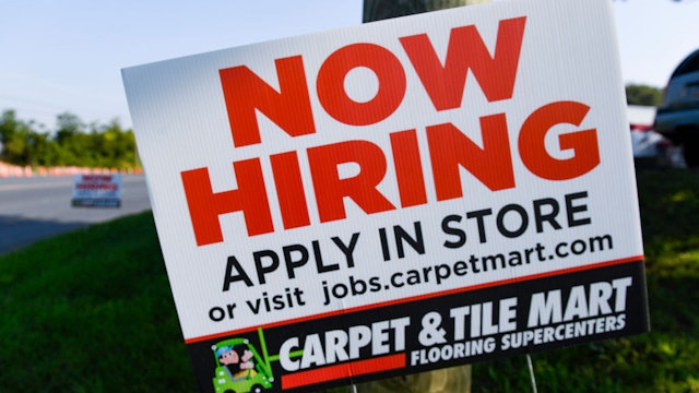 Muhlenberg, PA - August 26: A help wanted sign that reads "Now Hiring, Apply In Store" outside the Carpet and Tile Mart along 5th Street Highway in Muhlenberg Twp. Thursday morning August 26, 2021. (Photo by Ben Hasty/MediaNews Group/Reading Eagle via Getty Images)