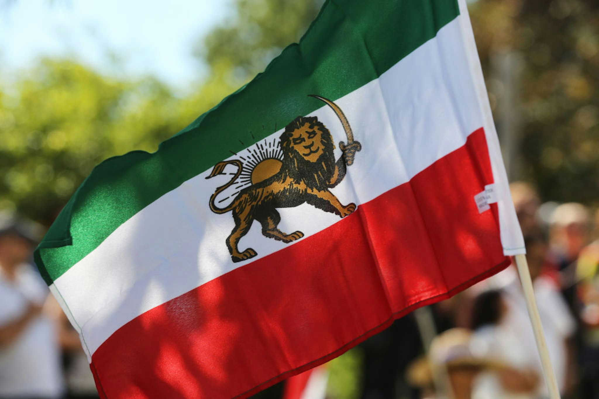 Iranian flag seen during the first ever Persian parade in Toronto, Ontario, Canada, on August 31, 2019. The parade showcased traditional costumes that illustrated the diverse cultural traditions and history of Iran.