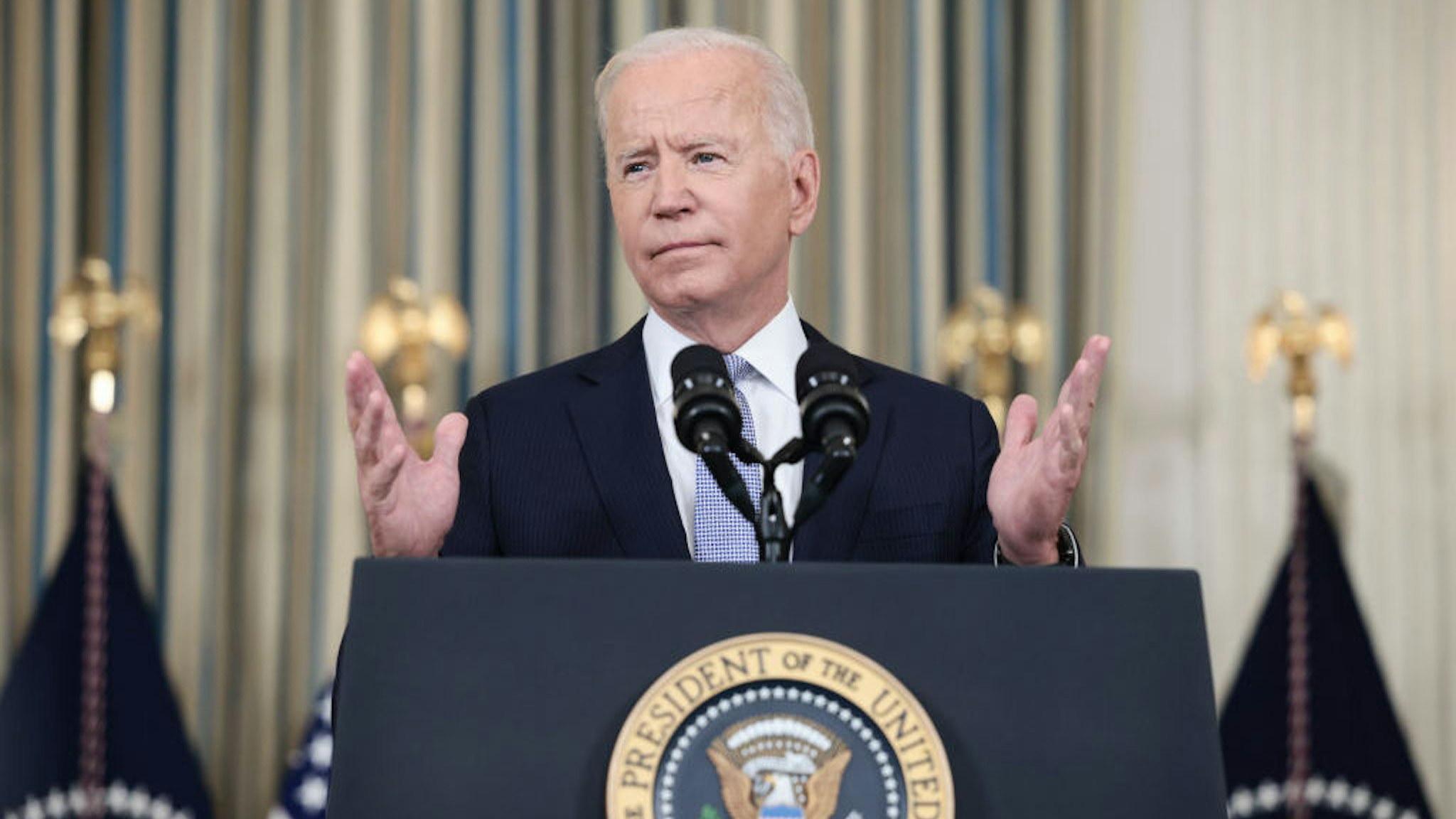 WASHINGTON, DC - SEPTEMBER 24: U.S. President Joe Biden gestures as he delivers remarks on his administration’s COVID-19 response and vaccination program from the State Dining Room of the White House on September 24, 2021 in Washington, DC. President Biden announced that Americans 65 and older and frontline workers who received the Pfizer-BioNTech COVID-19 vaccine over six months ago will be eligible for booster shots. (Photo by Anna Moneymaker/Getty Images)