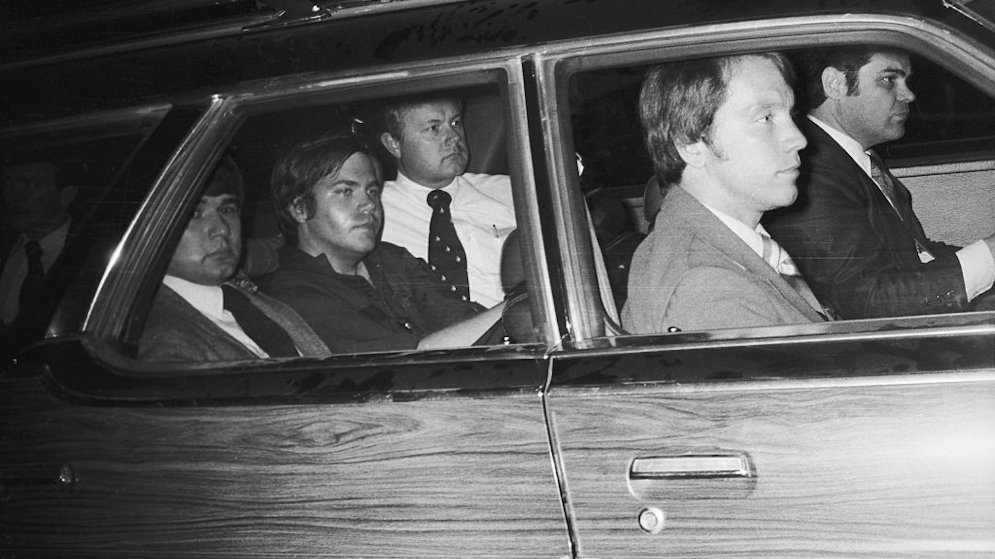 4/10/81-Washington, DC: John Hinckley, Jr. (center), the man charged with the attempted murder of President Reagan, now finds himself the center of Federal protection, March 30th, as he is driven away from U.S. District Court. Hinckley was seated in the center seat of a nine-seat section station with agents assigned to protect him, seated in front, alongside, and behind him. Ph: John Full