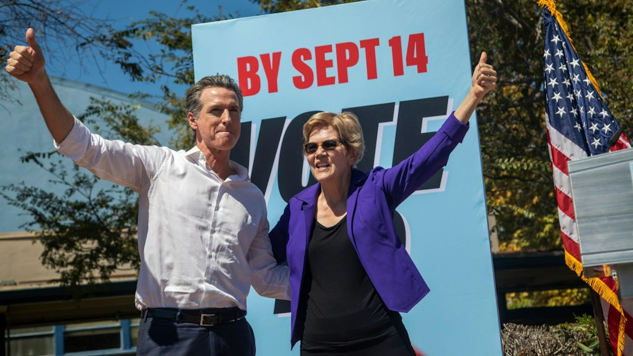 CULVER CITY, CA - SEPTEMBER 04: California Gov. Gavin Newsom and Sen. Elizabeth Warren (D-MA) take to the stage at a "Stop the Republican Recall" rally at Culver City High School on September 4 in Culver City, California.