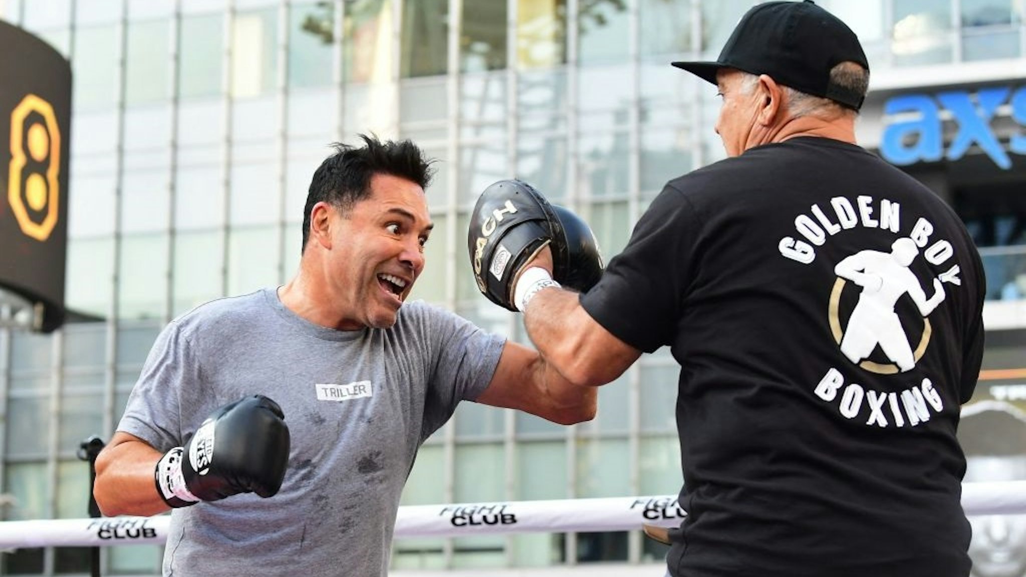 Former US Olympics Gold medalist professional boxer Oscar De La Hoya (L) spars with his partner during a public media workout in Los Angeles, California on August 24, 2021.