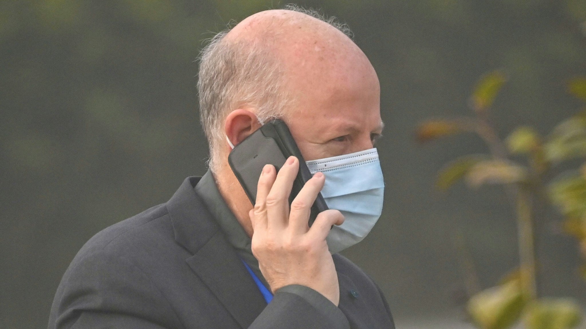 Peter Daszak, a member of the World Health Organization (WHO) team investigating the origins of the COVID-19 coronavirus, talks on his cellphone at the Hilton Wuhan Optics Valley in Wuhan, in China's central Hubei province on February 3, 2021.