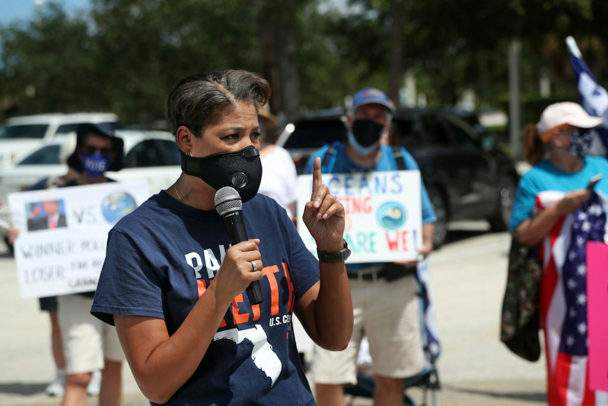 Congressional candidate Pam Keith, who is running against Rep. Brian Mast, speaks to anti-Trump protesters at Burt Reynolds Park in Jupiter, Florida on Tuesday, Sept. 8, 2020. President Donald Trump made an appearance at the Jupiter Inlet Lighthouse touting his environmental policies and announcing he's extending the moratorium on offshore oil drilling in Florida.