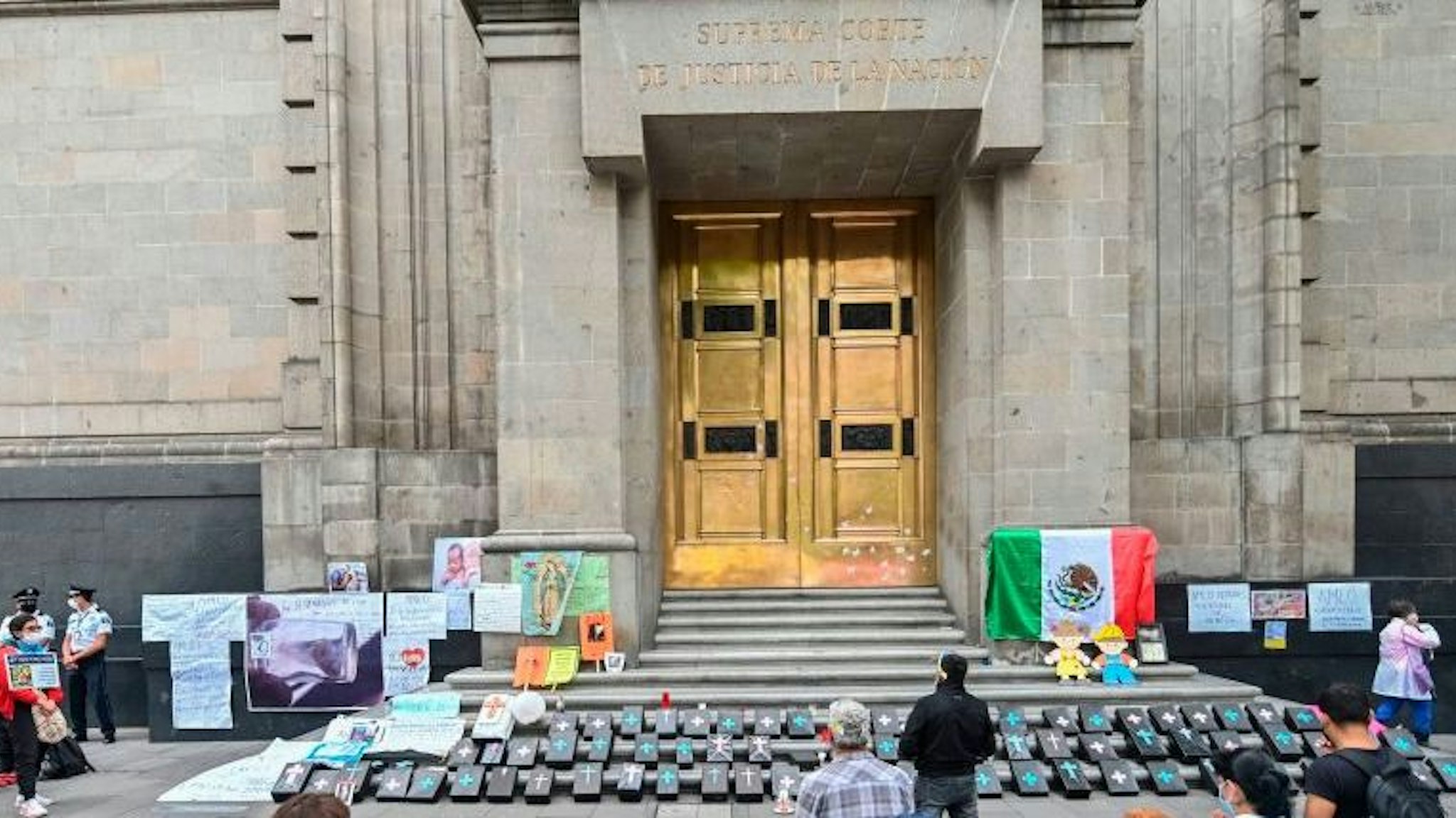Catholic anti-abortion activists pray during a protest outside the Mexican Supreme Court building in Mexico City, on July 29, 2020, amid the novel coronavirus pandemic. - The supreme court will debate on Wednesday a proposal that could lead to decriminalisation the abortion across the country.