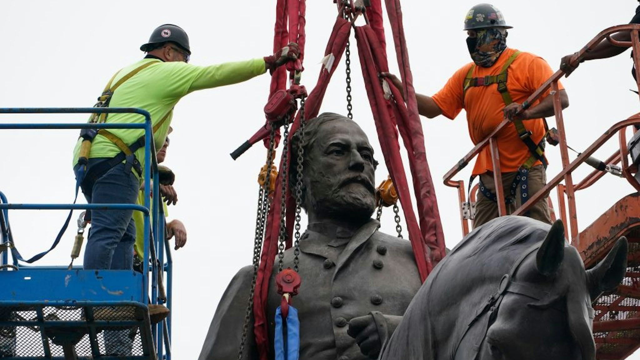 RICHMOND, VIRGINIA - SEPTEMBER 08: Crews prepare to remove one of the country's largest remaining monuments to the Confederacy, a towering statue of Confederate General Robert E. Lee on Monument Avenue, September 8, 2021 in Richmond, Virginia. The Commonwealth of Virginia is removing the largest Confederate statue remaining in the U.S. following authorization by all three branches of state government, including a unanimous decision by the Supreme Court of Virginia. September 8, 2021 in Richmond, Virginia. The Commonwealth of Virginia is removing the largest Confederate statue remaining in the U.S. following authorization by all three branches of state government, including a unanimous decision by the Supreme Court of Virginia.
