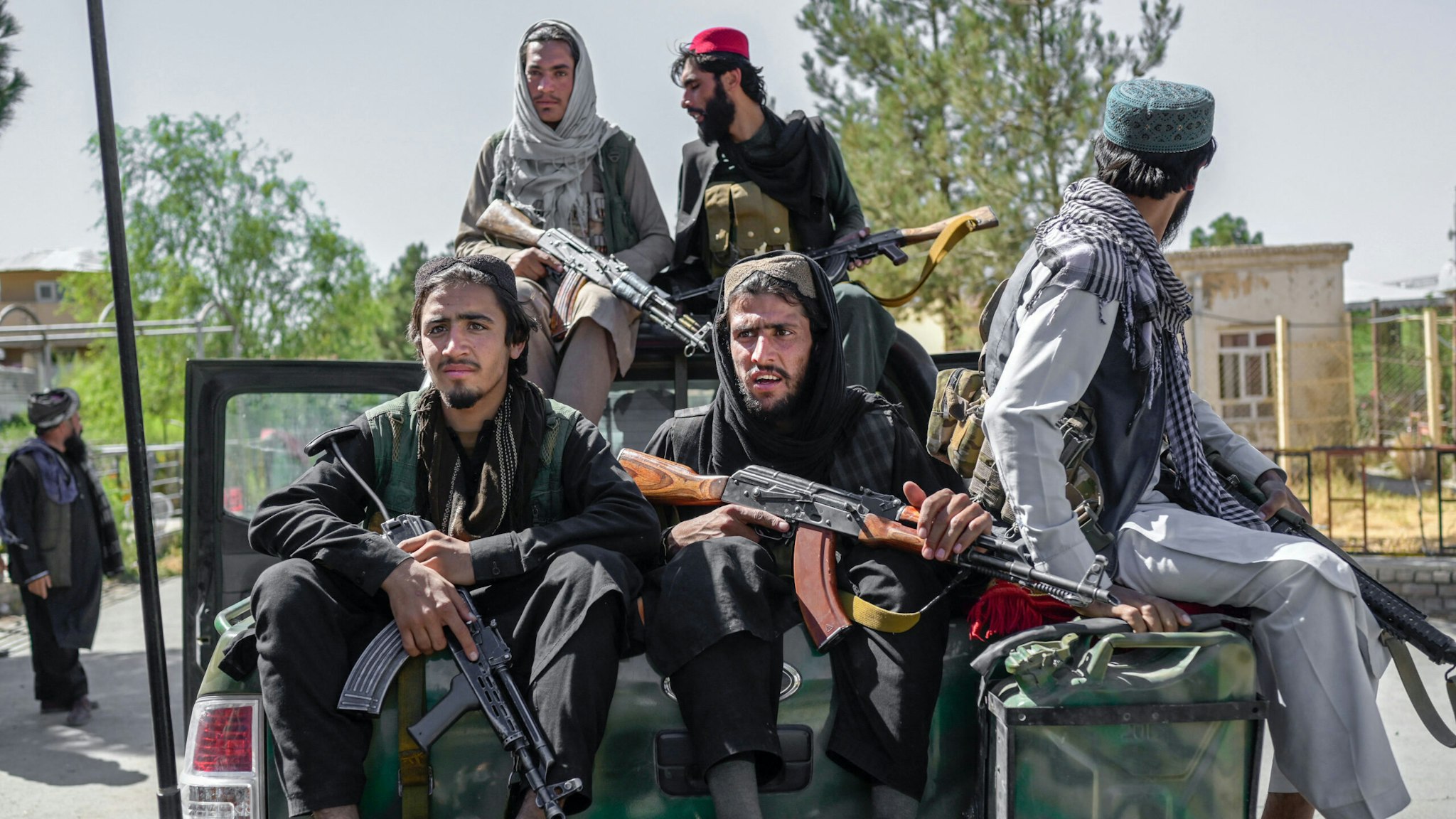 Members of the Taliban drive in the Pul-e-Charkhi prison in Kabul on September 16, 2021.