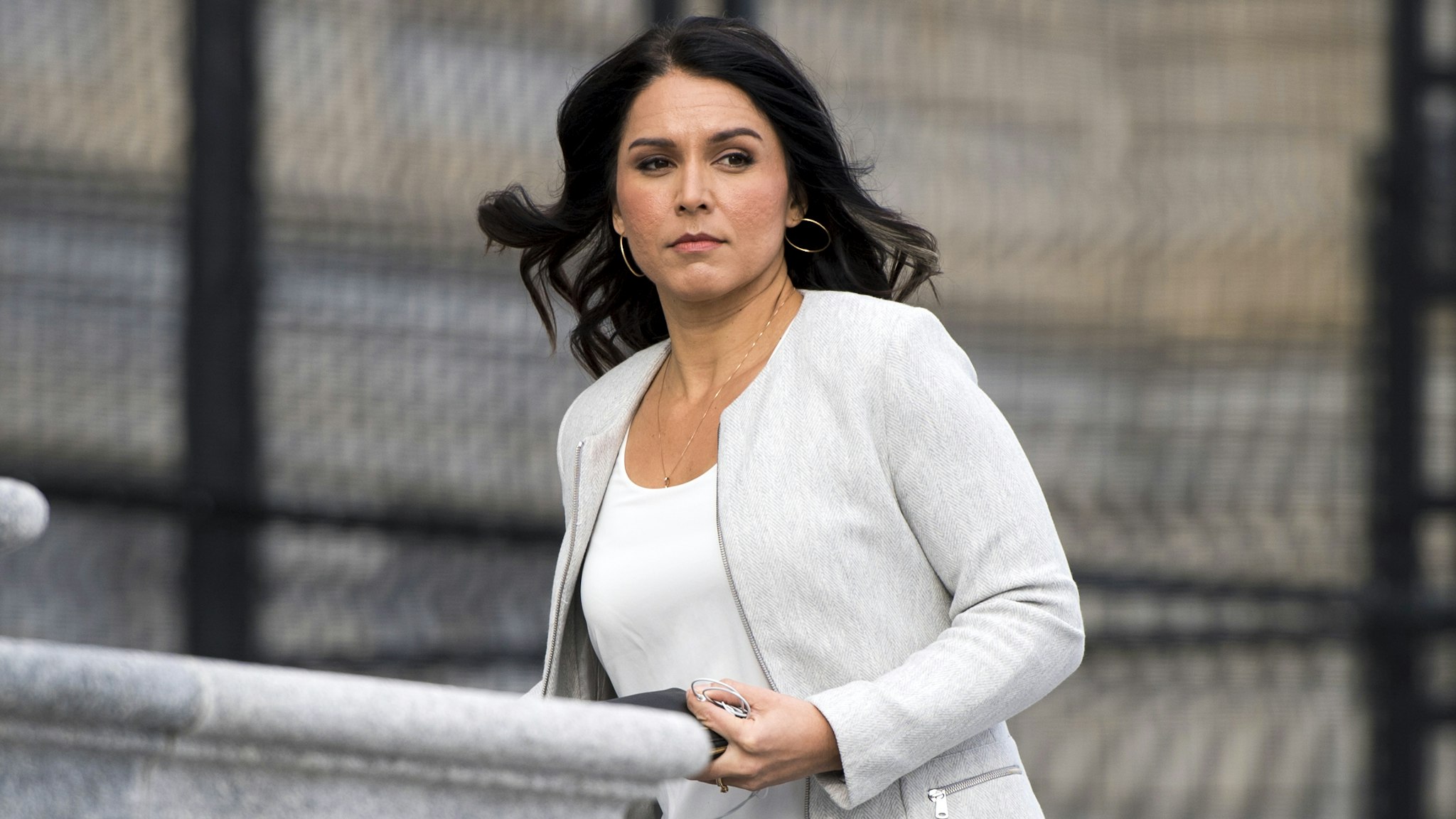 UNITED STATES - JANUARY 10: Rep. Tulsi Gabbard, D-Hawaii, walks up the House steps for the final votes of the week at the Capitol on Friday, Jan. 10, 2020.