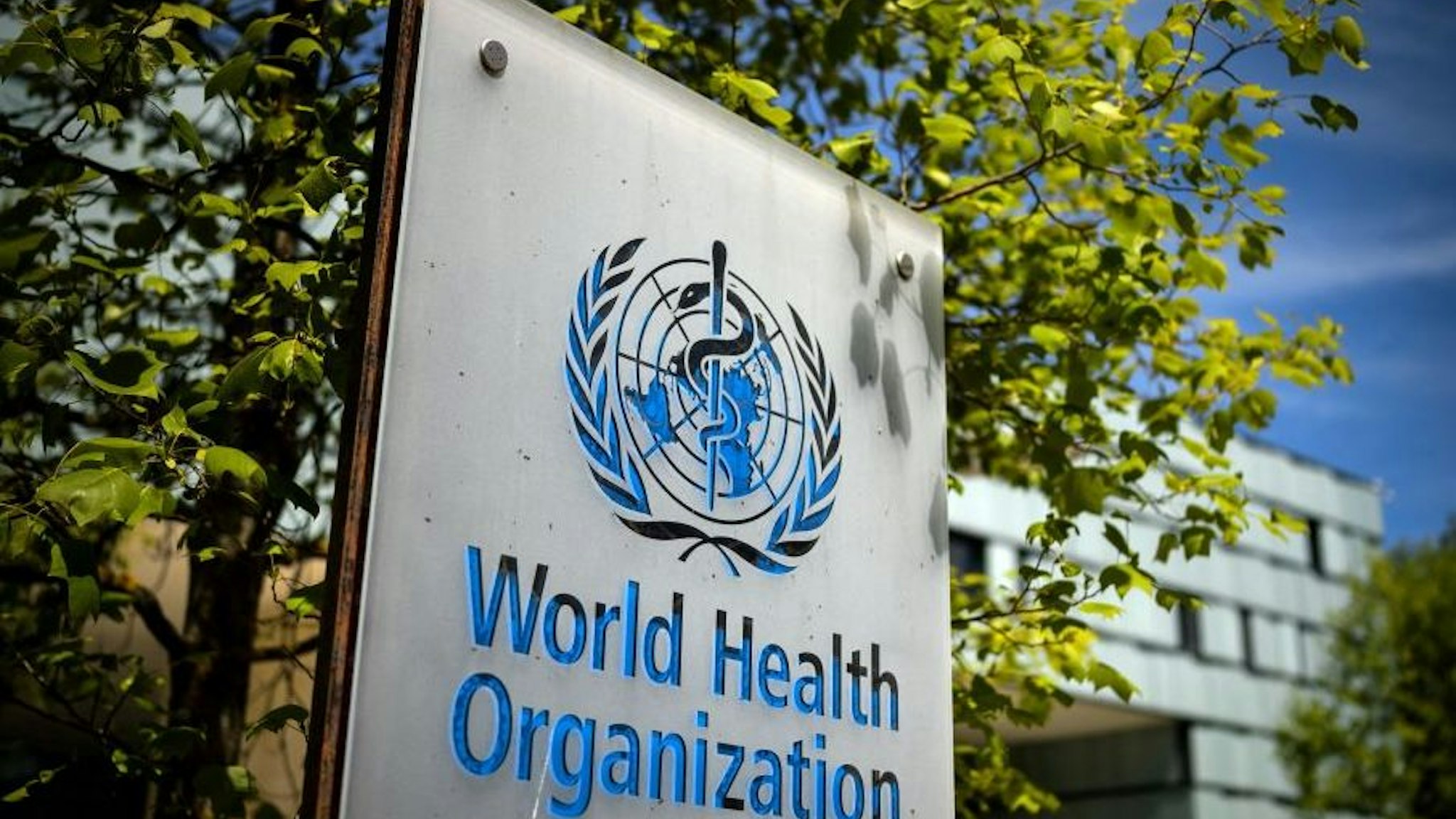 A picture taken on May 8, 2021 shows a sign of the World Health Organization (WHO) at the entrance of their headquarters in Geneva amid the Covid-19 coronavirus outbreak.