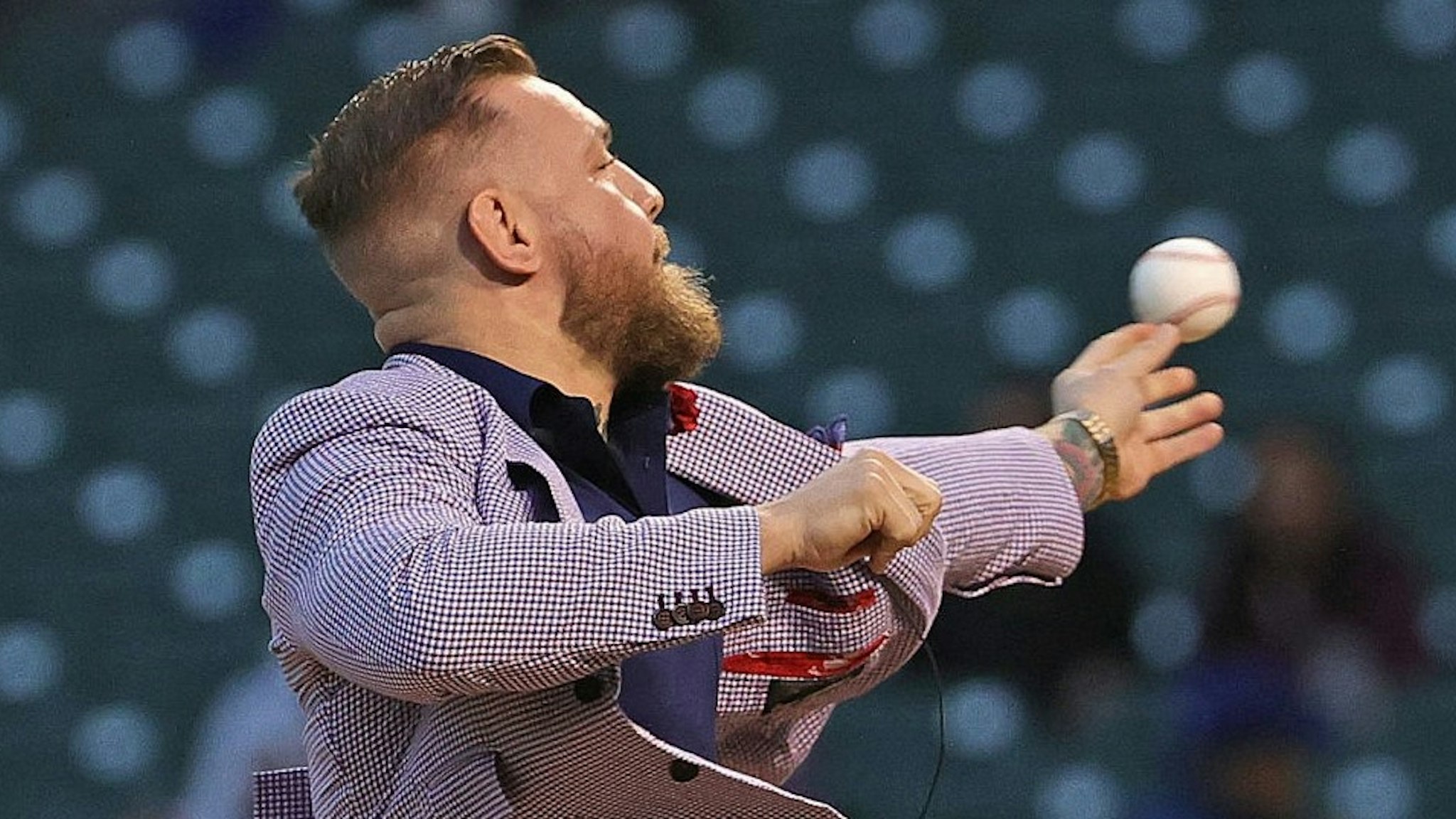CHICAGO, ILLINOIS - SEPTEMBER 21: Conor McGregor throws out a ceremonial first pitch before the Chicago Cubs take on the Minnesota Twins at Wrigley Field on September 21, 2021 in Chicago, Illinois. (Photo by