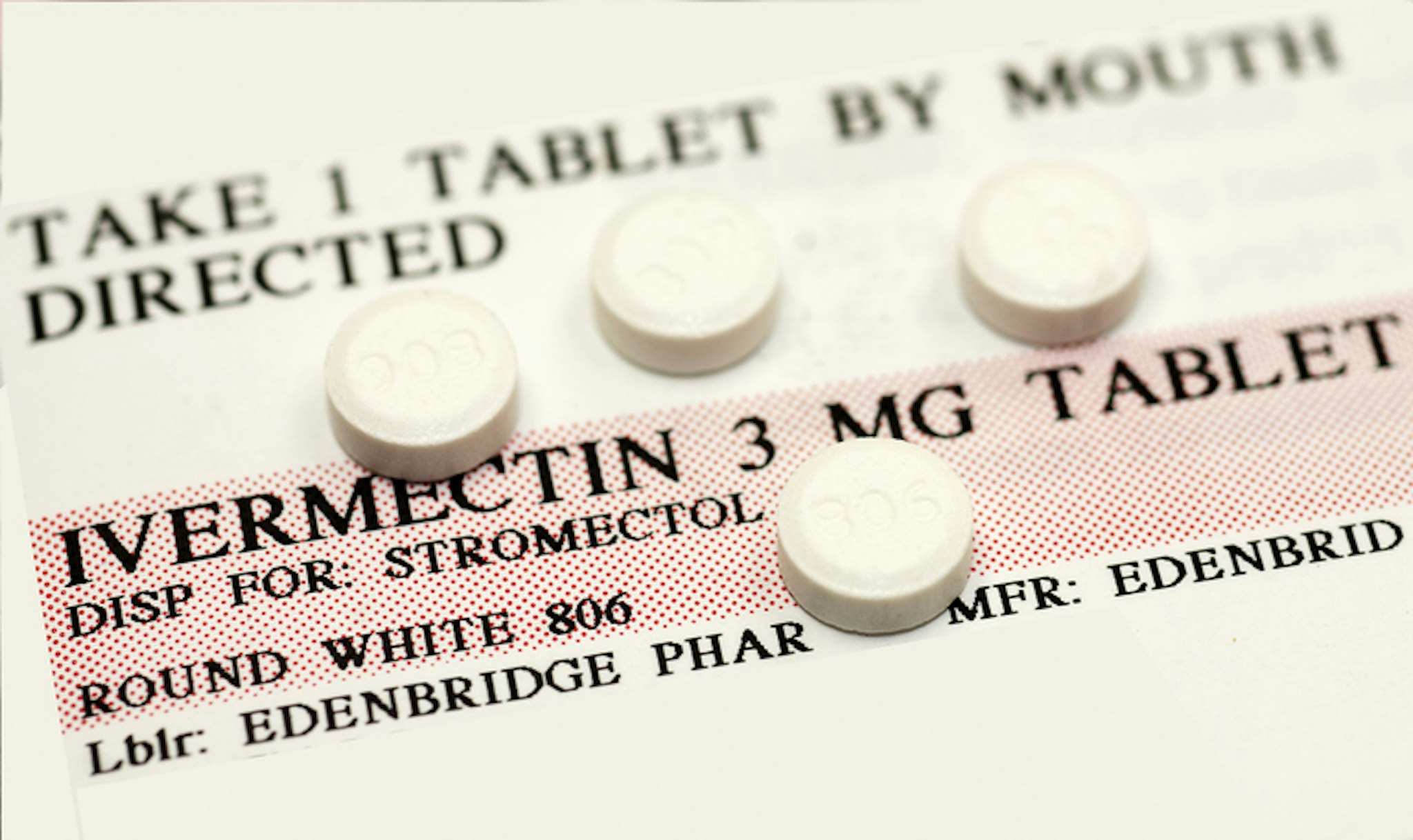 Ivermectin pills (a broad-spectrum antiparasitic agent) on top of instruction label