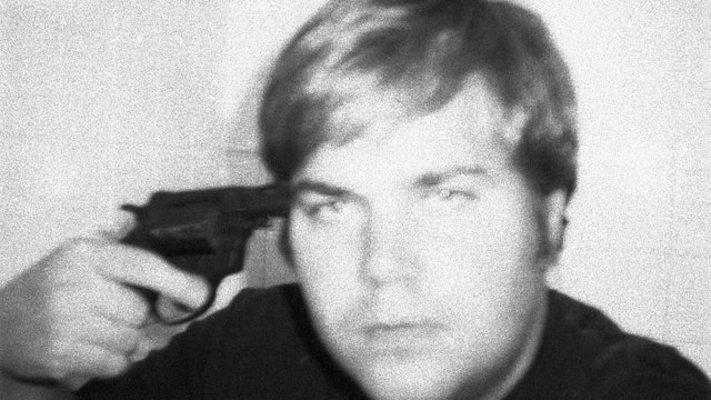 Self-portrait of John Hinckley Jr as he poses with a handgun held to his head, late 1970s, early 1980s. (Original Caption) 10/28/1982-Washington, DC-The FBI released this self-portrait of John Hinckley, who attempted to assassinate President Reagan in March, 1981. The picture was made with a polaroid camera. It was part of the evidence used in Hinckley's trial.