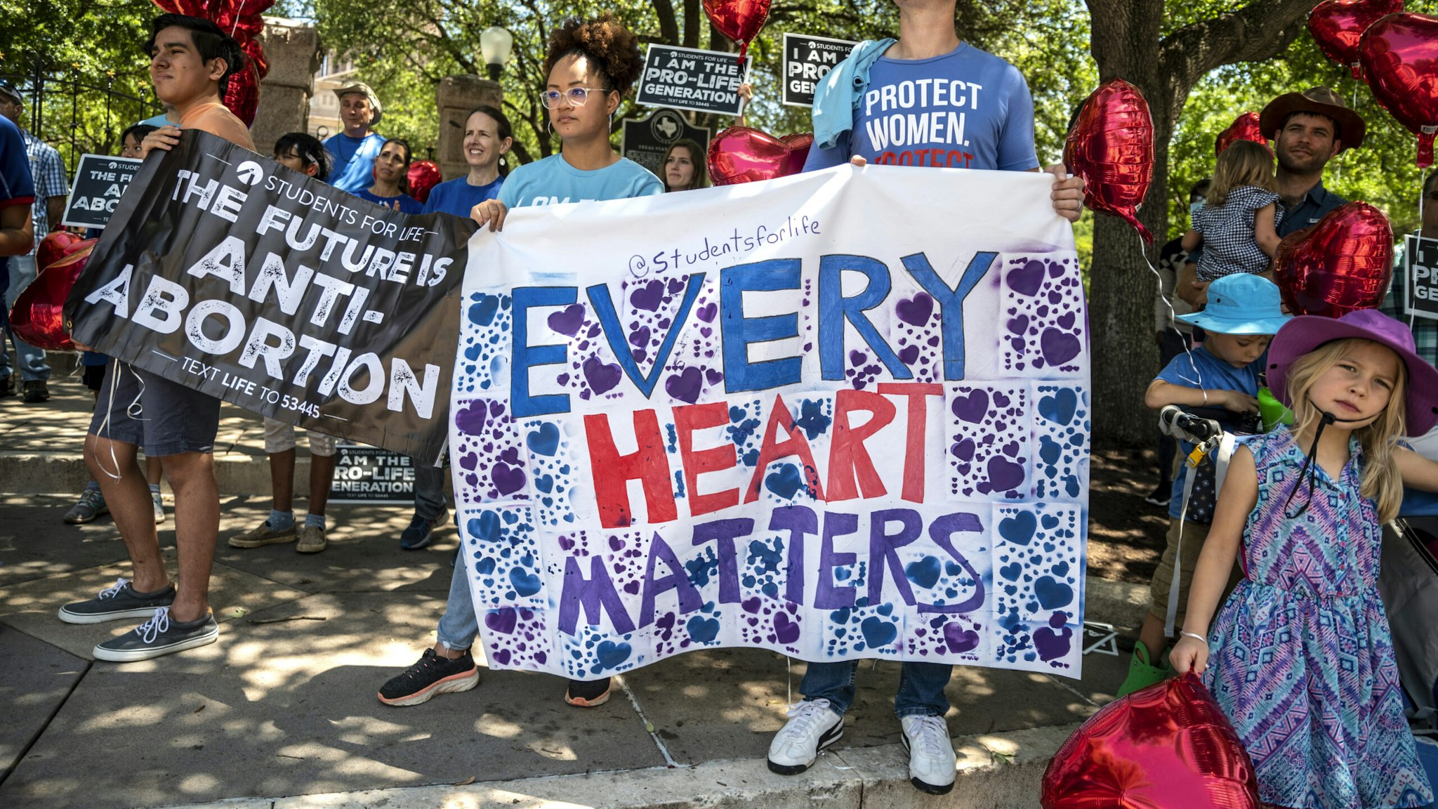 AUSTIN, TX - MAY 29: Pro-life protesters stand near the gate of the Texas state capitol at a protest outside the Texas state capitol on May 29, 2021 in Austin, Texas. Thousands of protesters came out in response to a new bill outlawing abortions after a fetal heartbeat is detected signed on Wednesday by Texas Governor Greg Abbot.