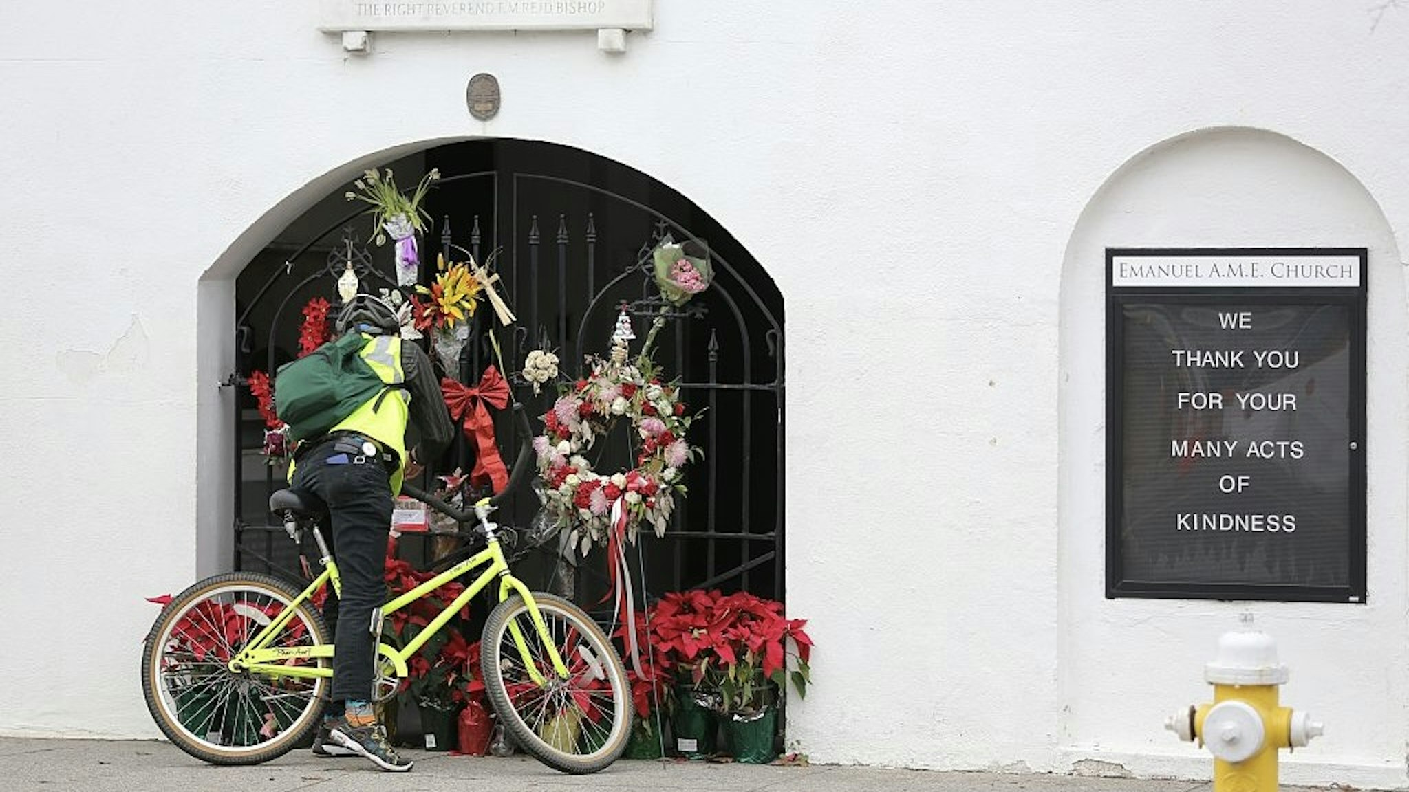 US-CRIME-MURDER-RACISM-COURT A man stops to observe the makeshift memorial in front of Mother Emanuel AME Church in downtown Charleston, South Carolina on January 4, 2017. Dylann Roof, the self-described white supremacist who gunned down nine black churchgoers in a Charleston church, offered no apology or motive for his actions as a jury began considering whether to sentence him to death. / AFP / Logan Cyrus (Photo credit should read LOGAN CYRUS/AFP via Getty Images) LOGAN CYRUS / Stringer