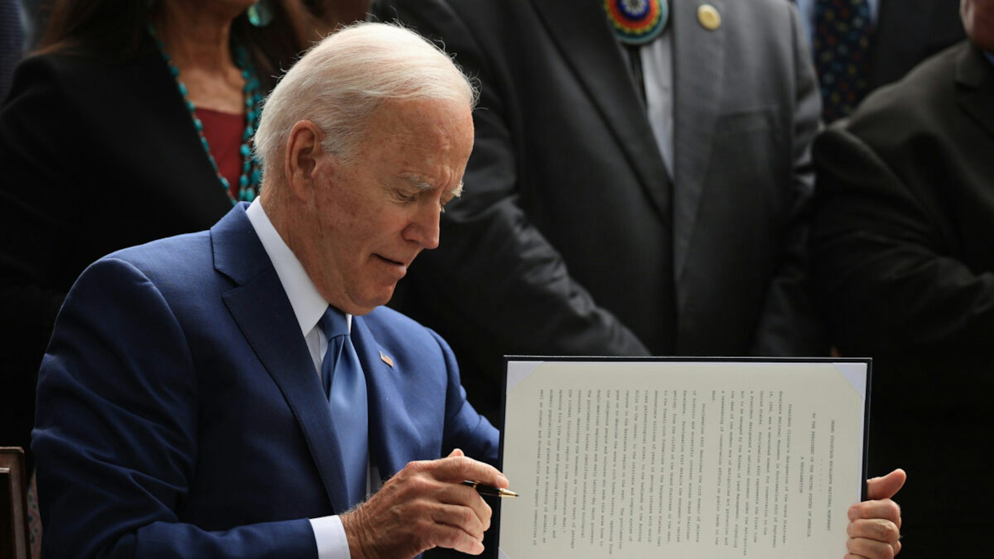 U.S. President Joe Biden signs proclamations expanding the areas of three national monuments at the White House on October 08, 2021 in Washington, DC.